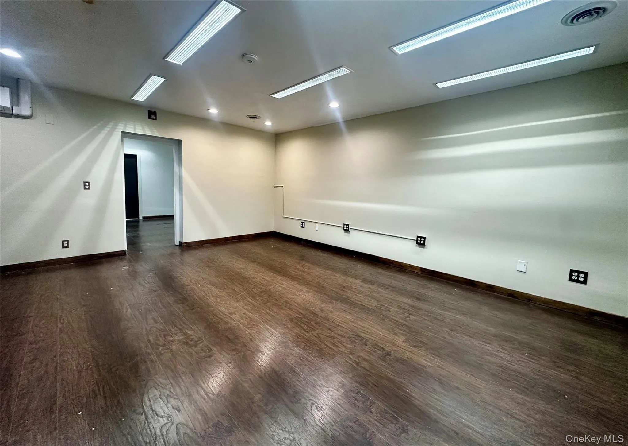 Freshly Painted, Blank Canvas Commerical Space Unfurnished featuring dark wood-style floors and recessed lighting. Freshly Painted, Blank Canvas Commerical Space Unfurnished featuring dark wood-style floors and recessed lighting.