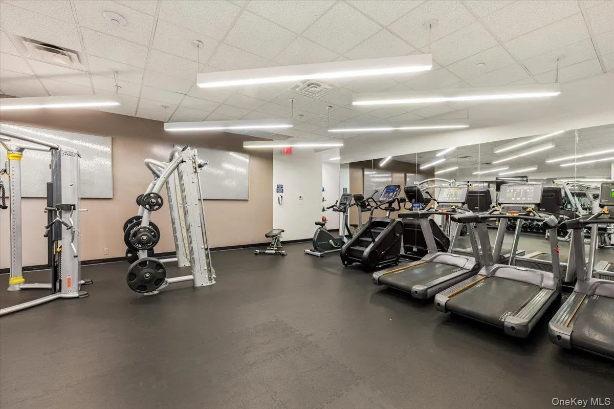 Gym featuring a paneled ceiling Gym featuring a paneled ceiling