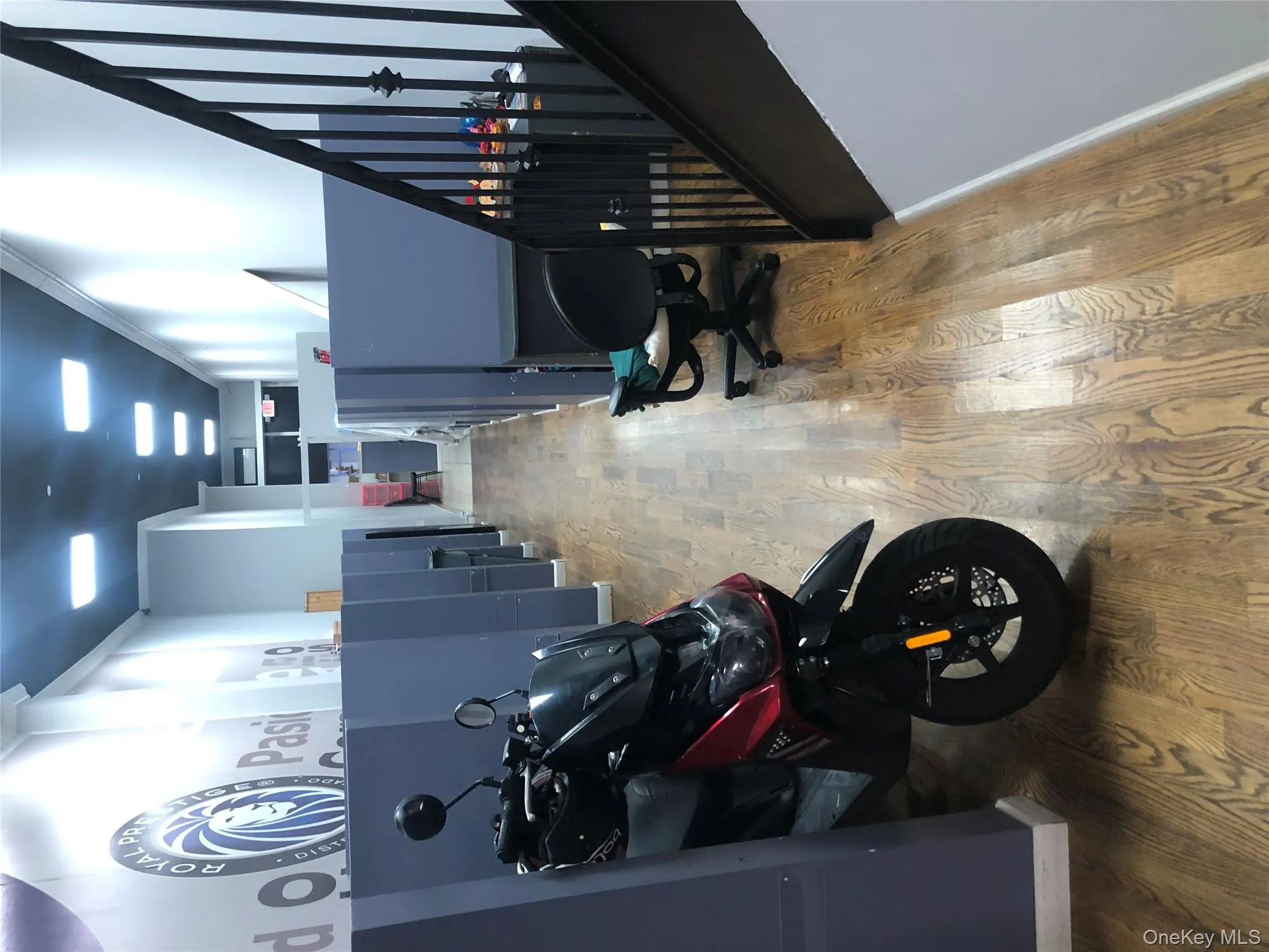 Misc room with crown molding and light wood-style floors Misc room with crown molding and light wood-style floors