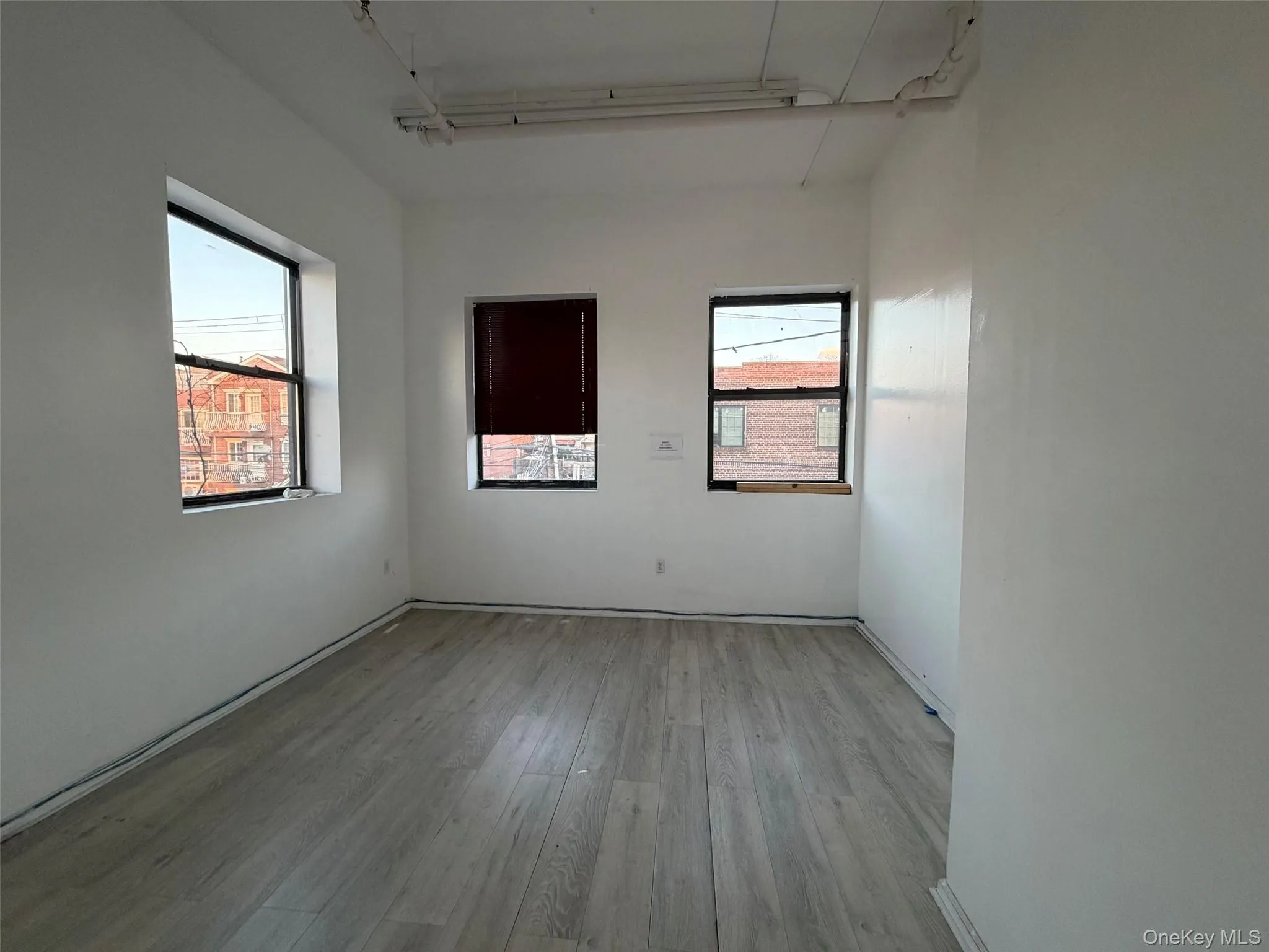 Spare room featuring light wood-type flooring Spare room featuring light wood-type flooring