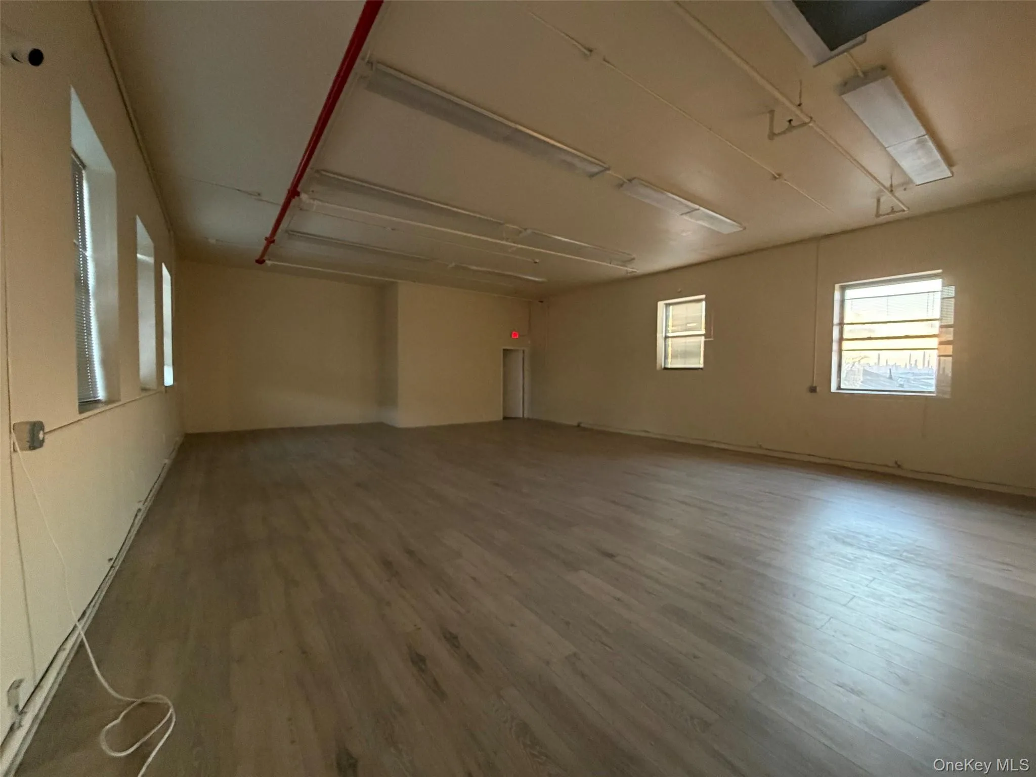 Unfurnished room with wood finished floors Unfurnished room with wood finished floors