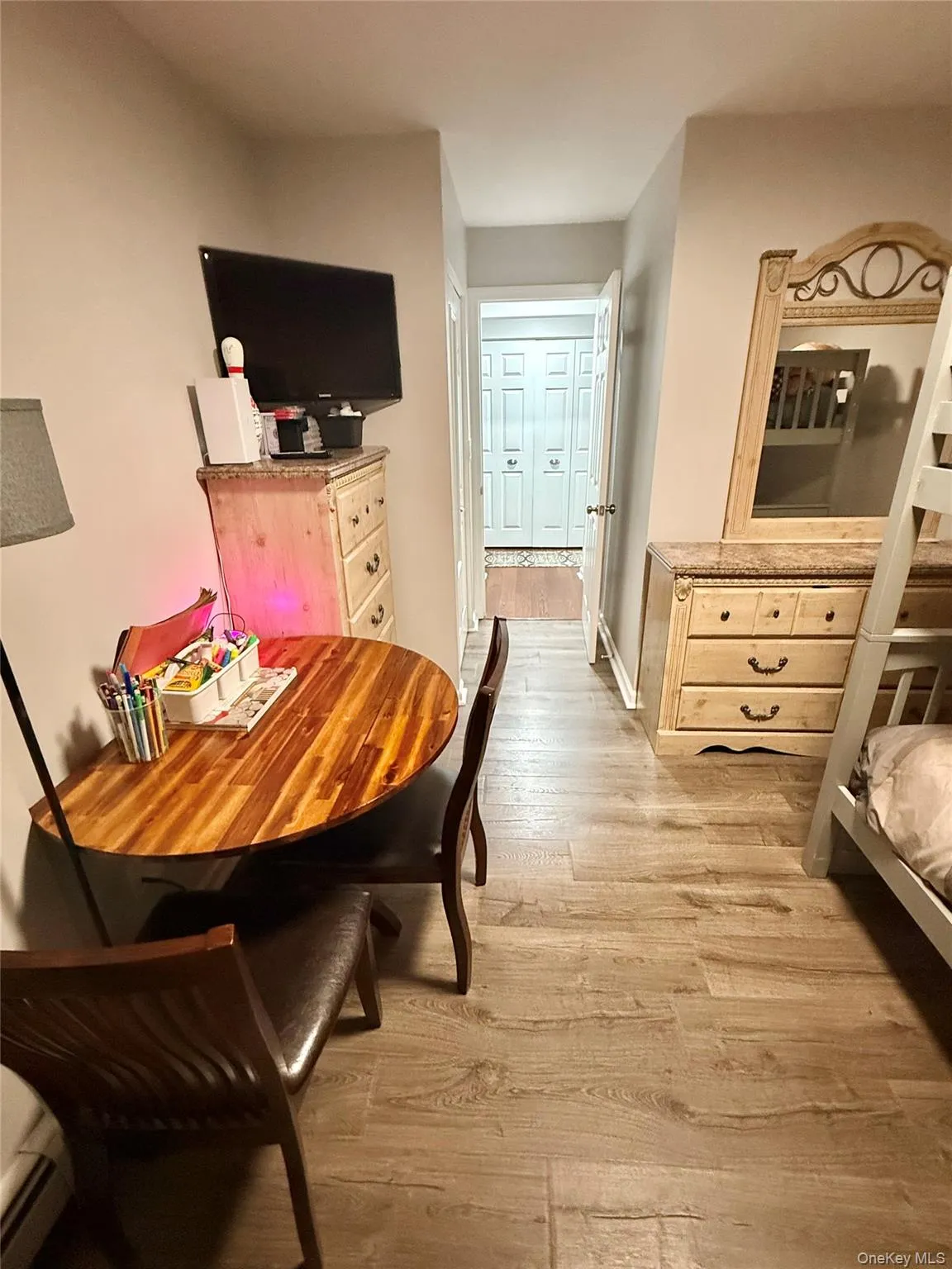 Dining area with light wood finished floors Dining area with light wood finished floors
