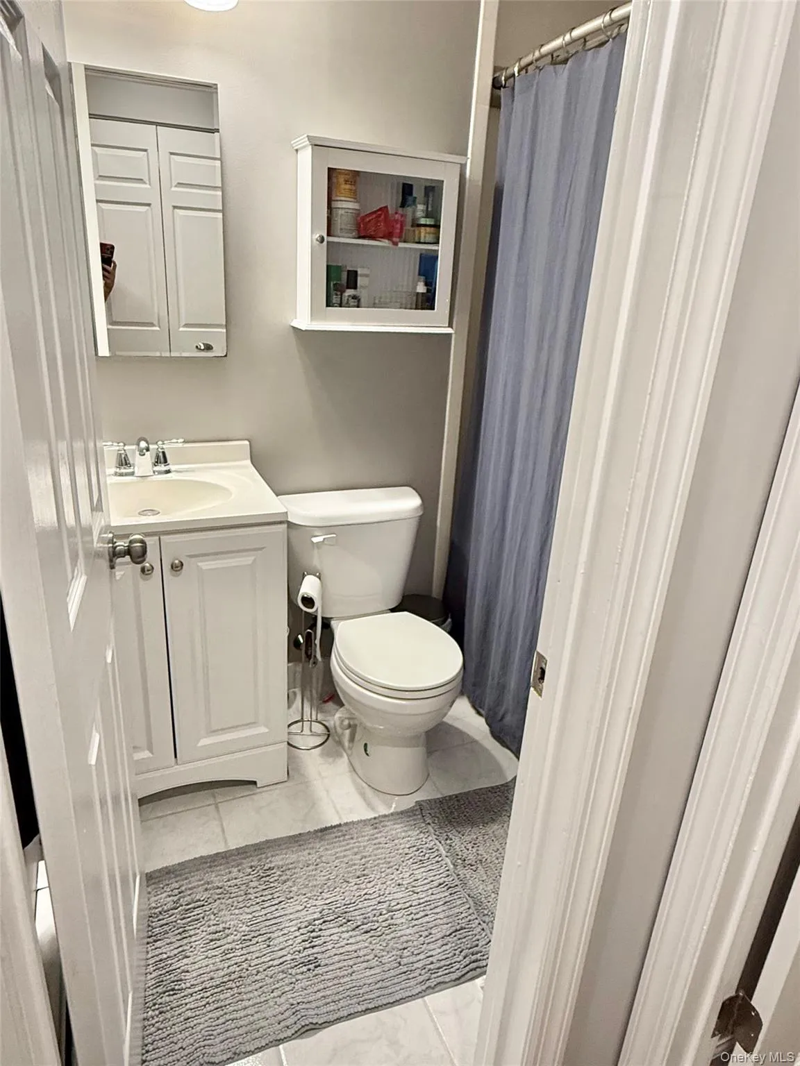 Full bathroom featuring vanity and a shower with curtain Full bathroom featuring vanity and a shower with curtain