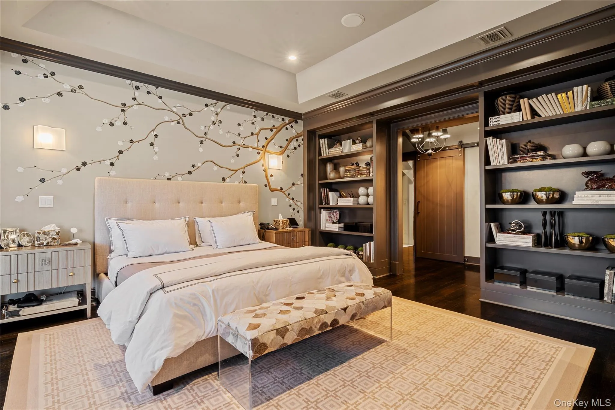 Bedroom with dark wood finished floors and recessed lighting Bedroom with dark wood finished floors and recessed lighting
