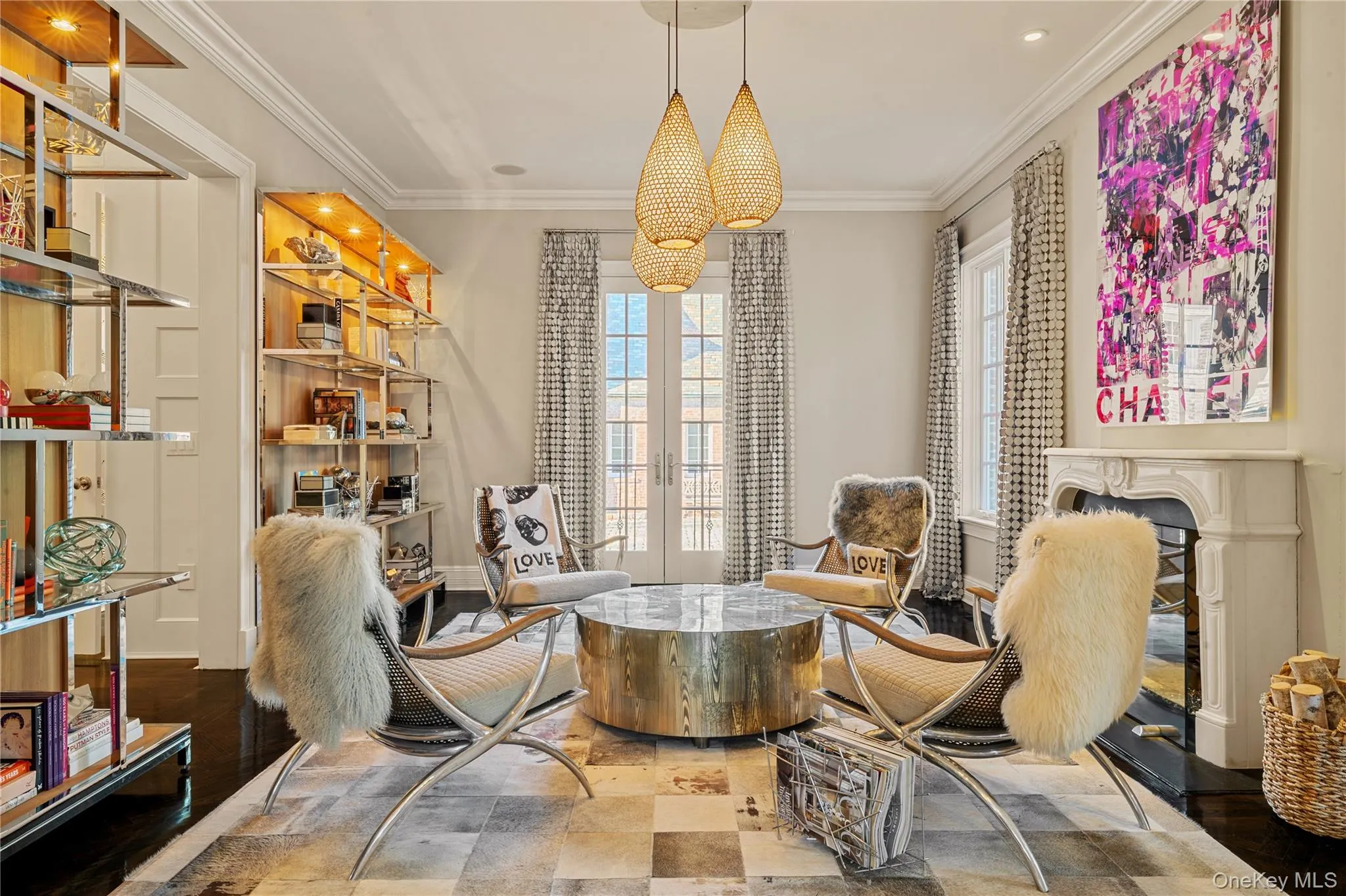 Living area featuring french doors, a chandelier, and ornamental molding Living area featuring french doors, a chandelier, and ornamental molding