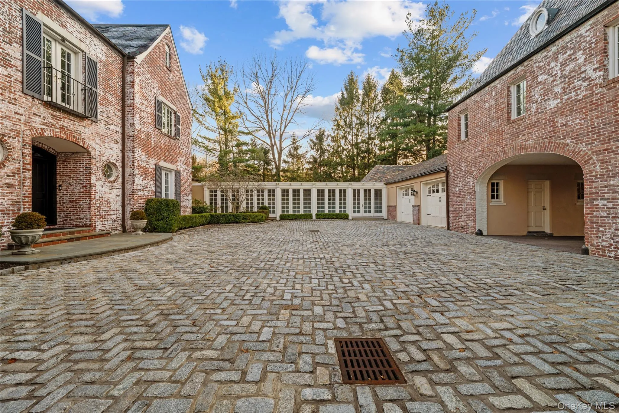 Surrounding community with decorative driveway Surrounding community with decorative driveway