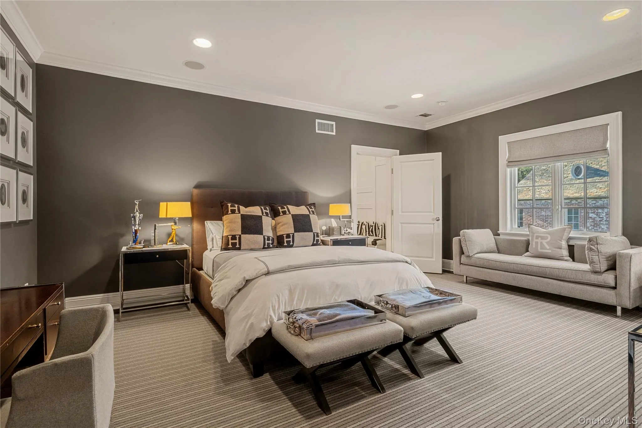 Carpeted bedroom with recessed lighting and ornamental molding Carpeted bedroom with recessed lighting and ornamental molding