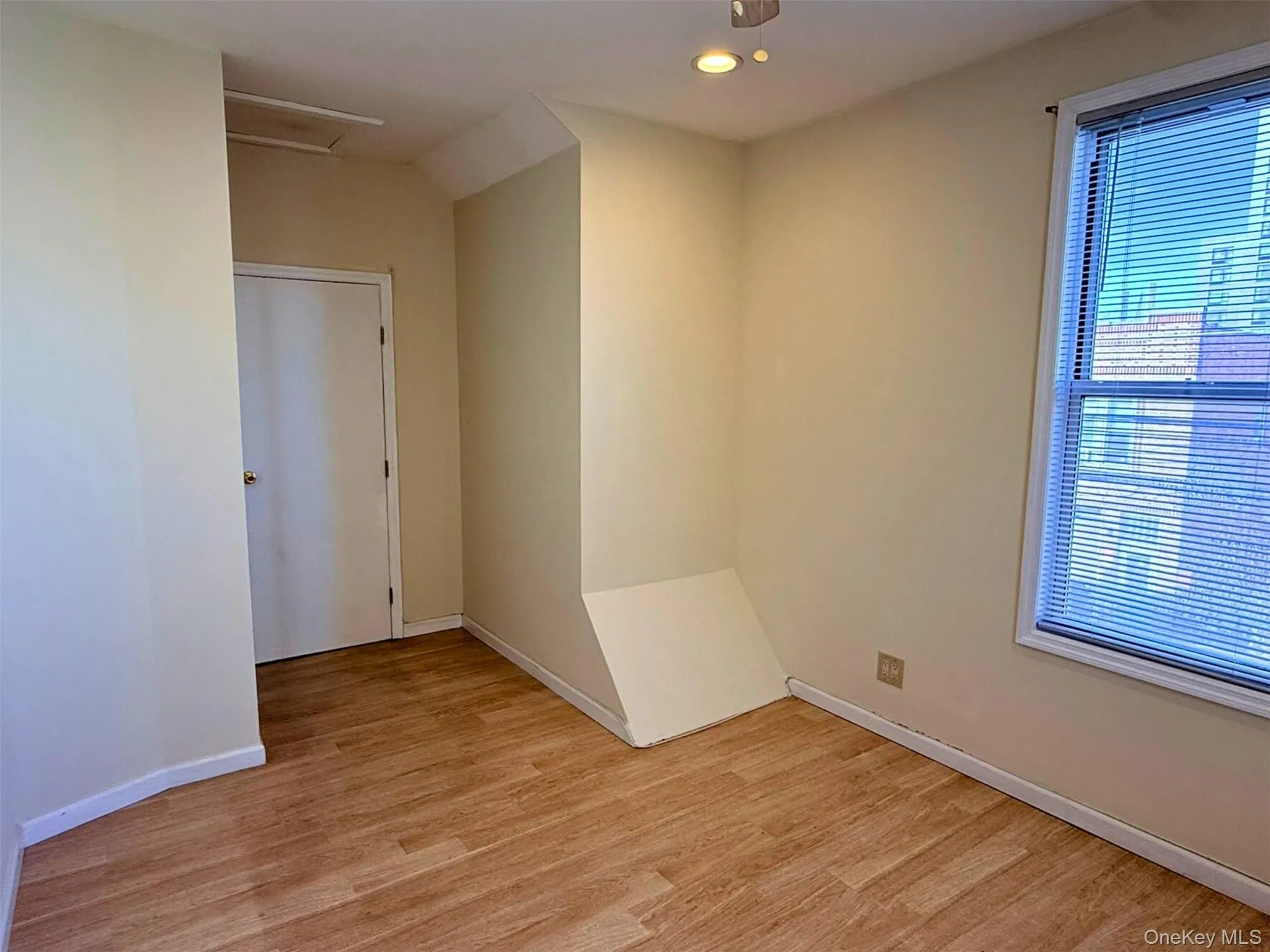 Empty room featuring light wood-style flooring and recessed lighting Empty room featuring light wood-style flooring and recessed lighting