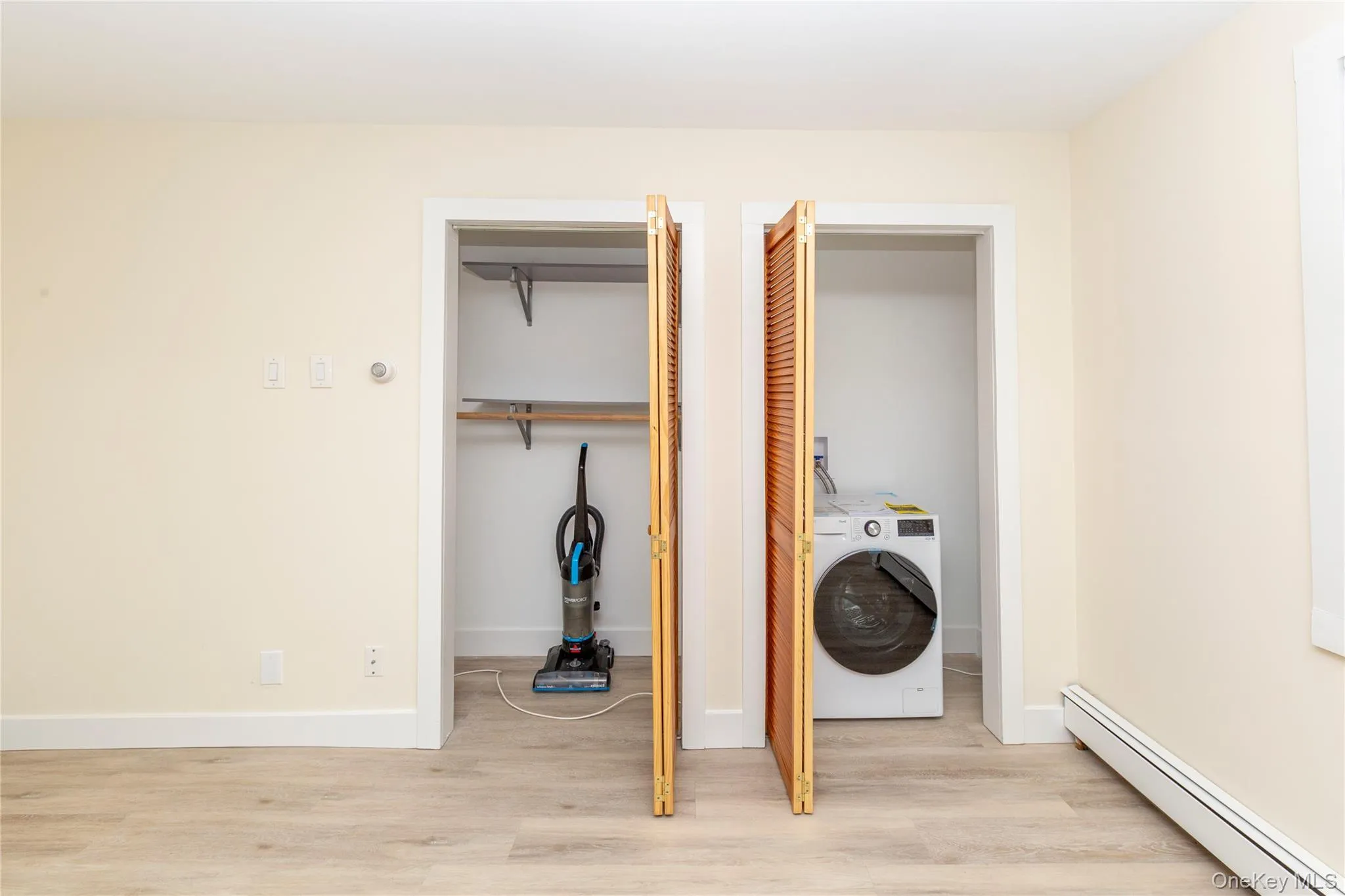 Two closets with a brand-new combination washer and dryer in one of the closets. Shelving in the other for hall closet, pantry or storage. Two closets with a brand-new combination washer and dryer in one of the closets. Shelving in the other for hall closet, pantry or storage.