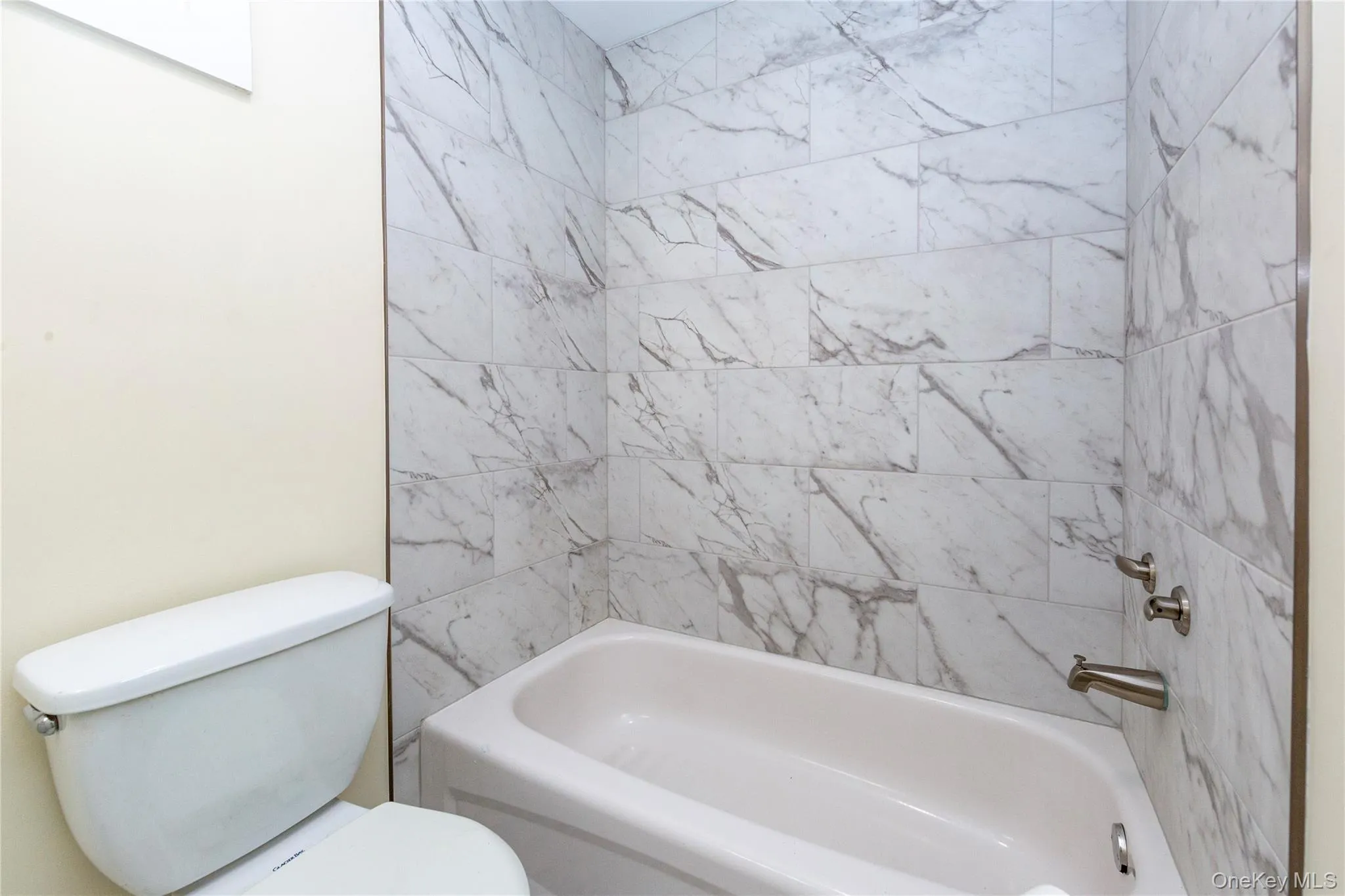 Newly tiled bathroom. Newly tiled bathroom.