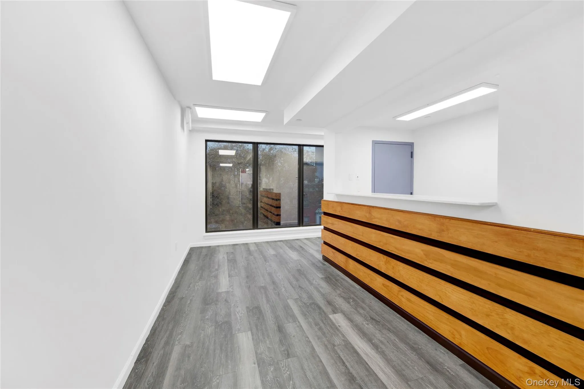 Empty room featuring baseboards and light wood-style floors Empty room featuring baseboards and light wood-style floors