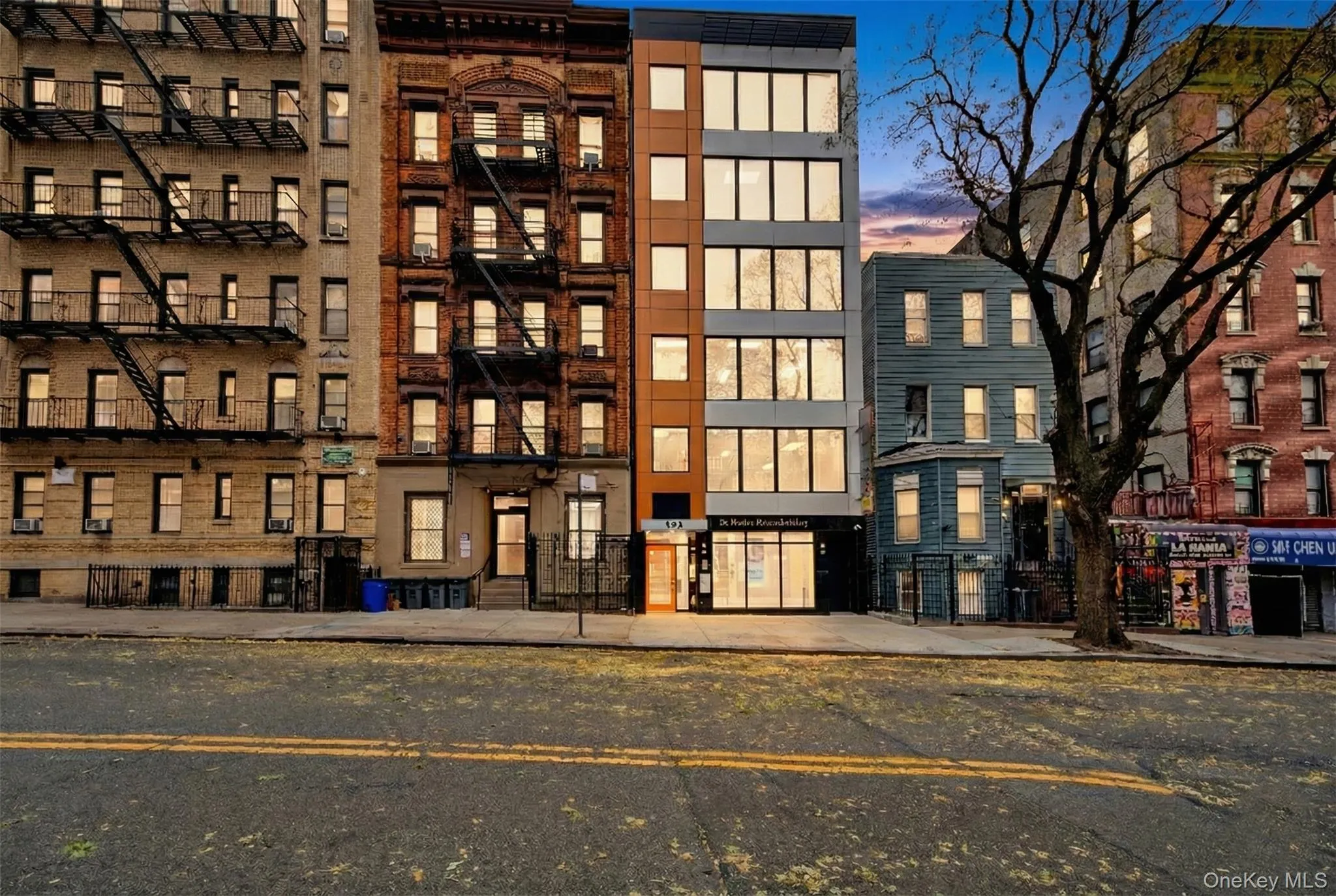 Property at dusk with a view of apartment building / complex Property at dusk with a view of apartment building / complex