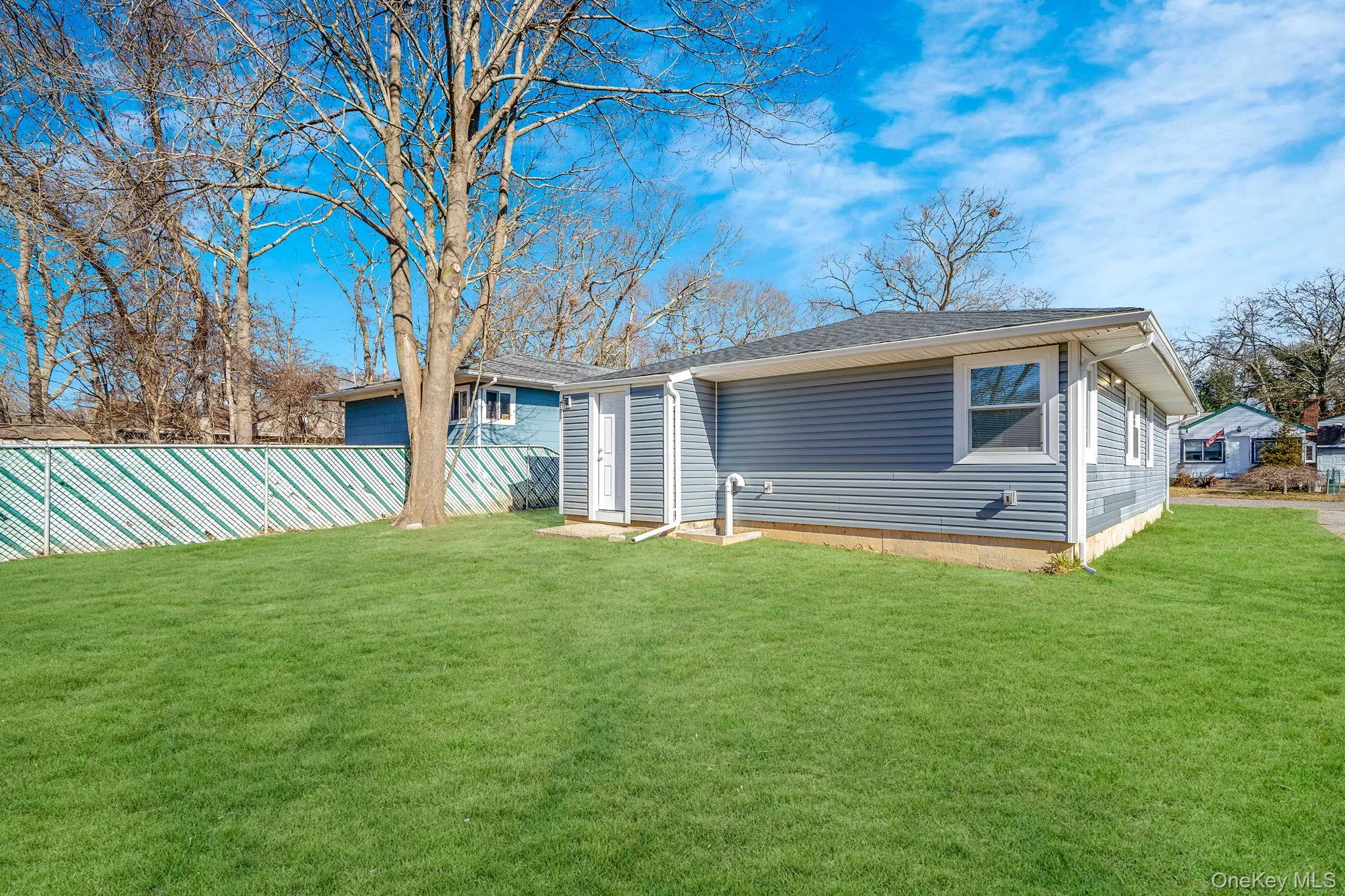 Back of house with roof with shingles Back of house with roof with shingles