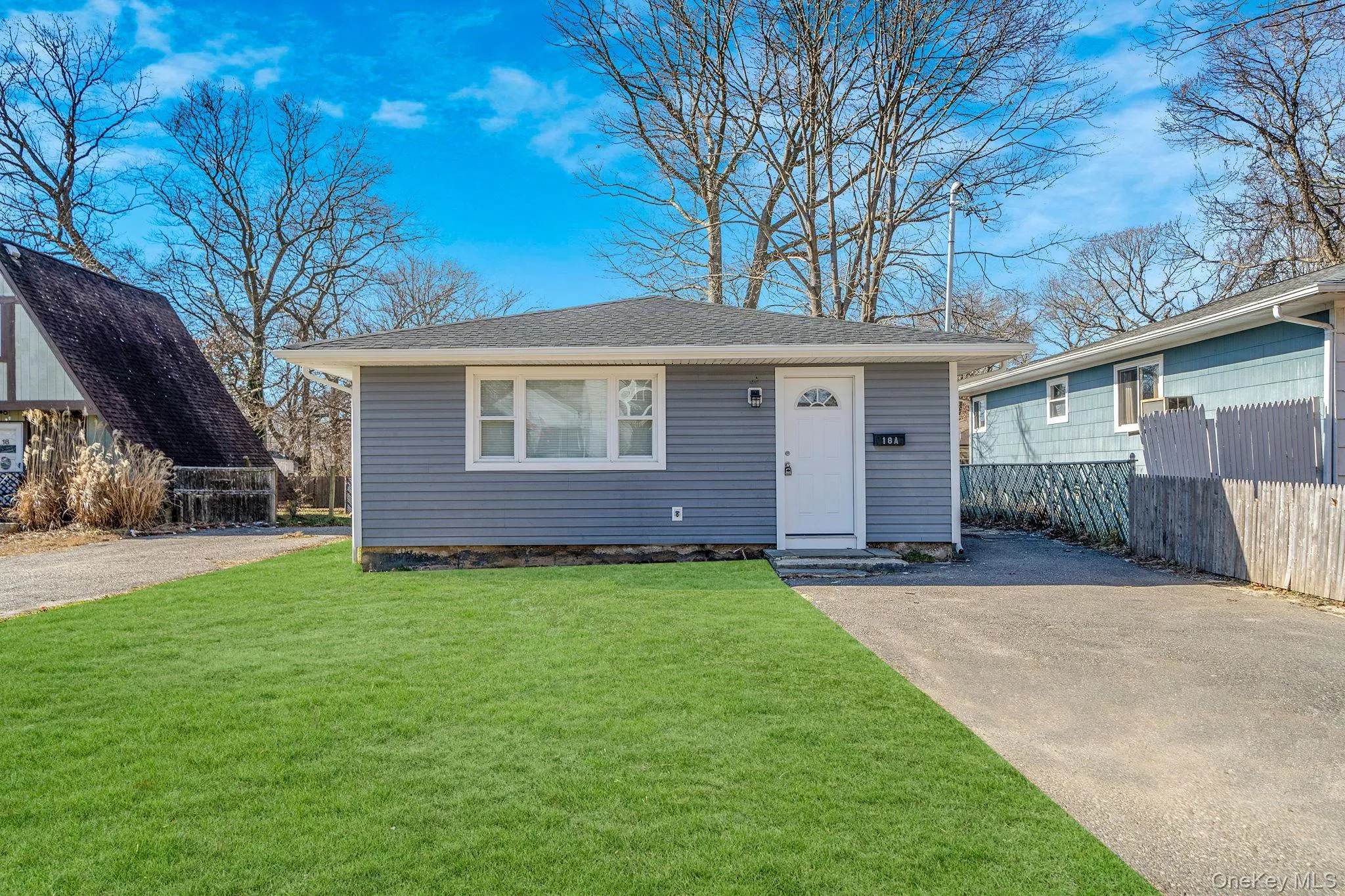 Bungalow-style home with roof with shingles and driveway Bungalow-style home with roof with shingles and driveway