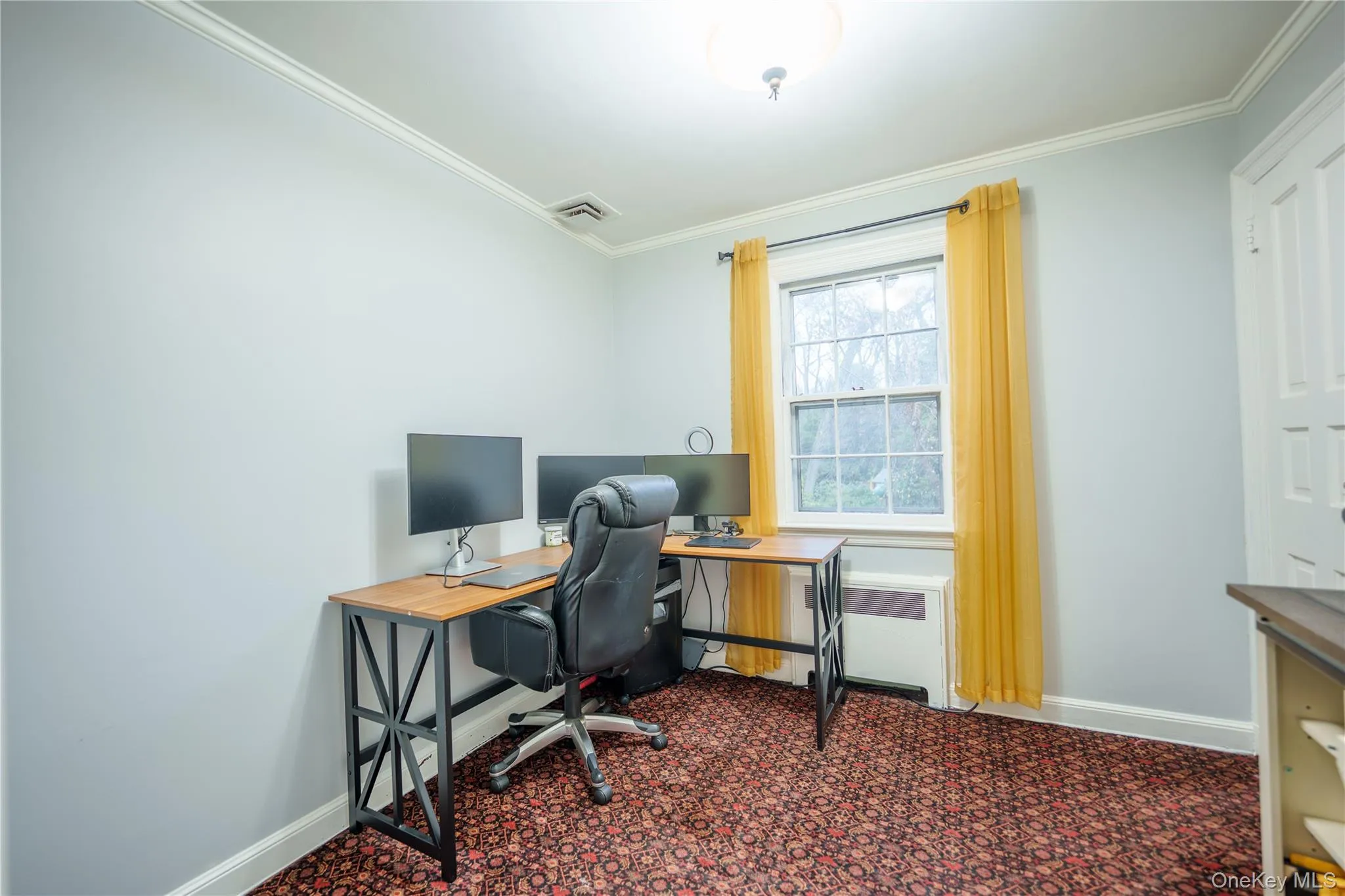 Upper Level Home office with dark carpet & small closet. Upper Level Home office with dark carpet & small closet.