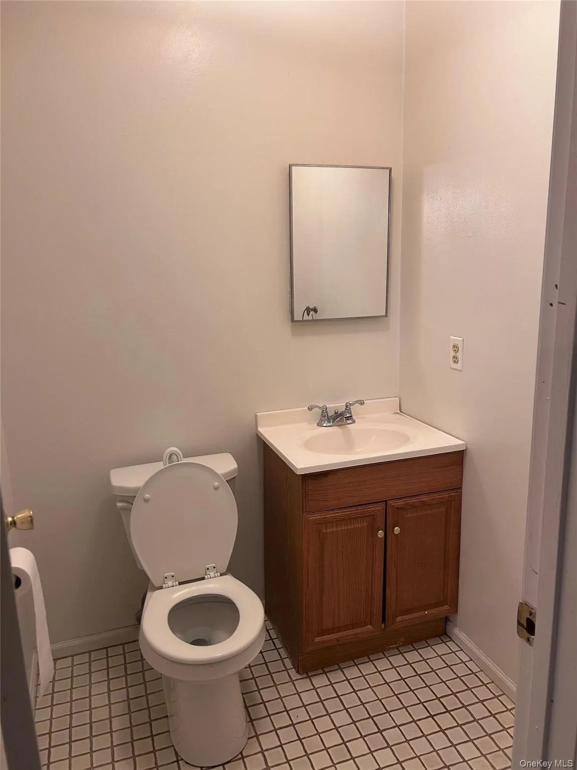 Half bathroom with vanity and toilet Half bathroom with vanity and toilet