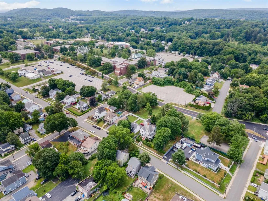 Aerial perspective of suburban area featuring mountains Aerial perspective of suburban area featuring mountains