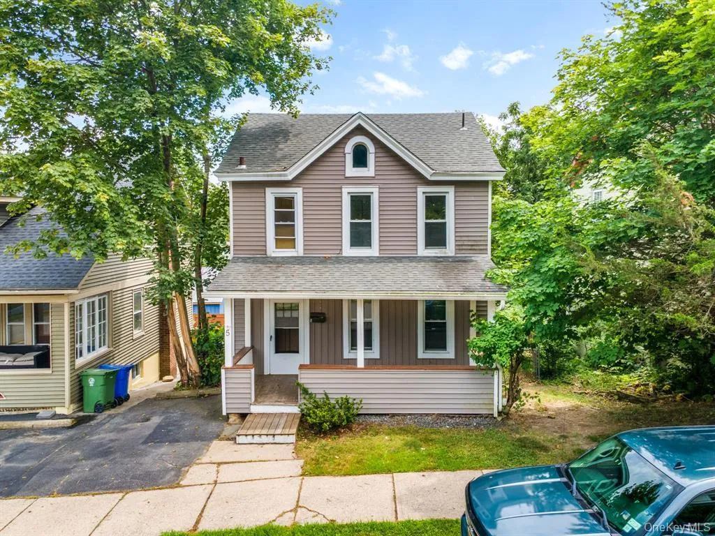 View of front of home featuring a shingled roof, board and batten siding, and a porch View of front of home featuring a shingled roof, board and batten siding, and a porch