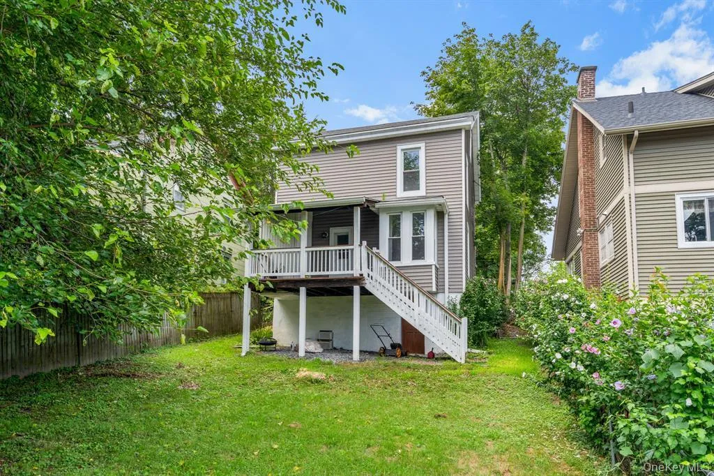 Back of property with stairway and a deck Back of property with stairway and a deck