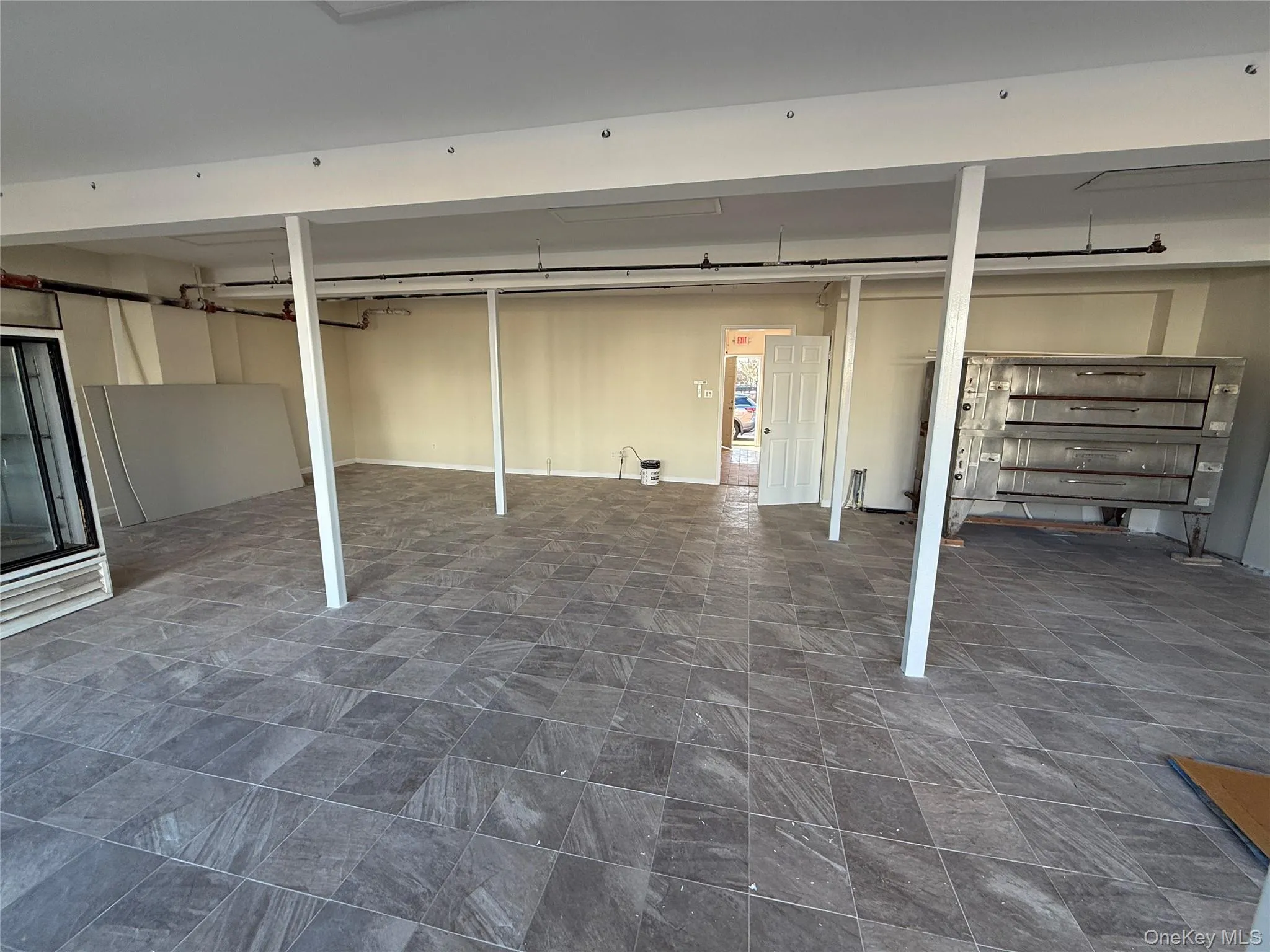 Finished below grade area featuring stone finish floors Finished below grade area featuring stone finish floors