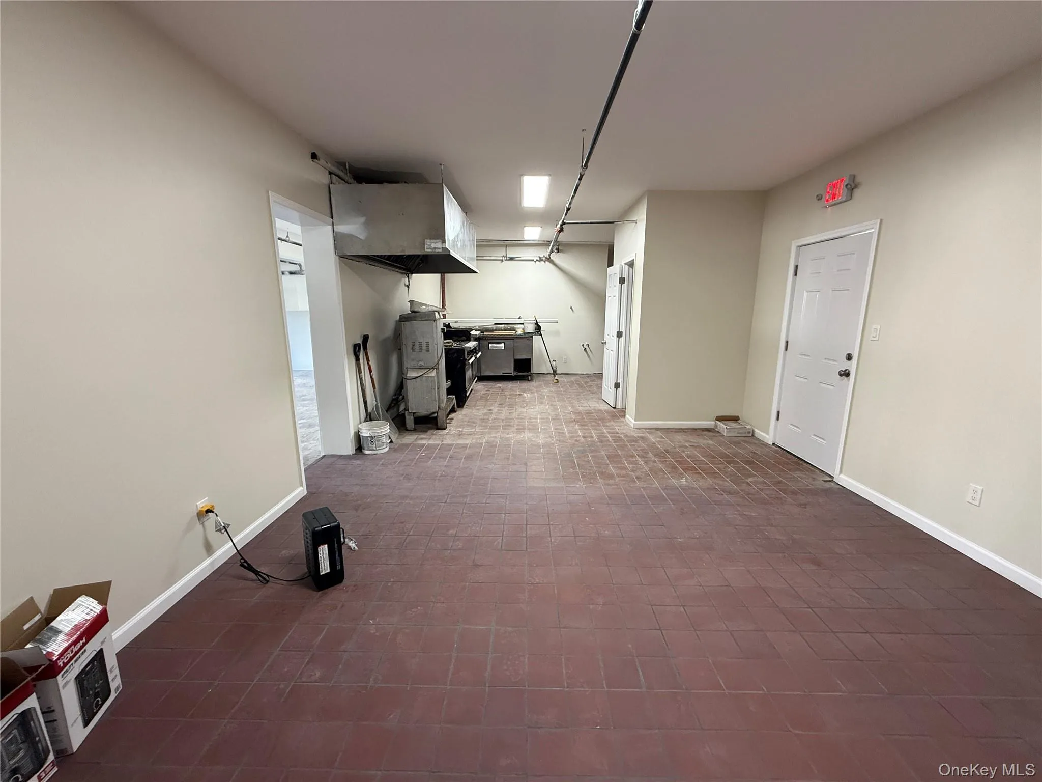 Basement featuring baseboards and a heating unit Basement featuring baseboards and a heating unit