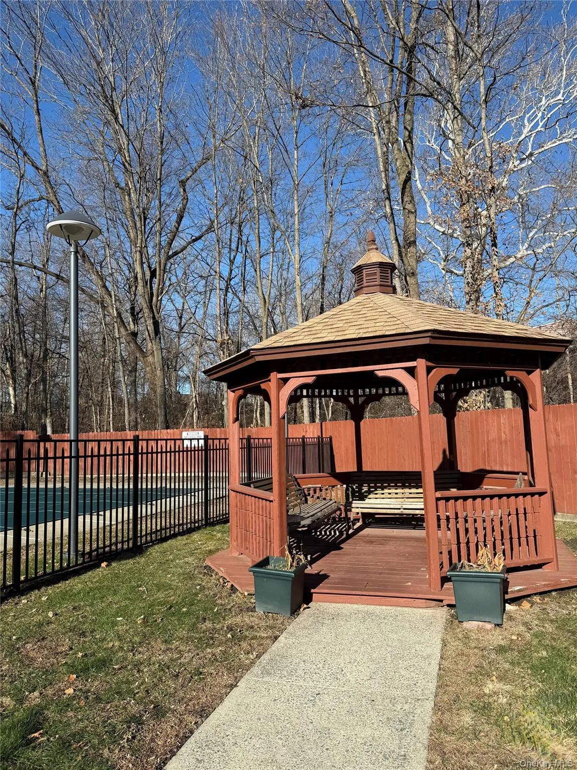 View of gazebo area next to the pool. View of gazebo area next to the pool.