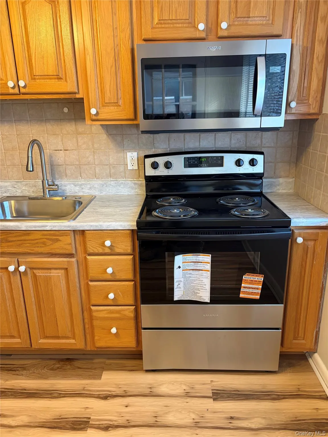 Kitchen featuring stainless steel electric stove Kitchen featuring stainless steel electric stove