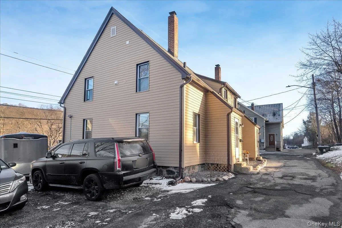 View of side of home with a chimney View of side of home with a chimney