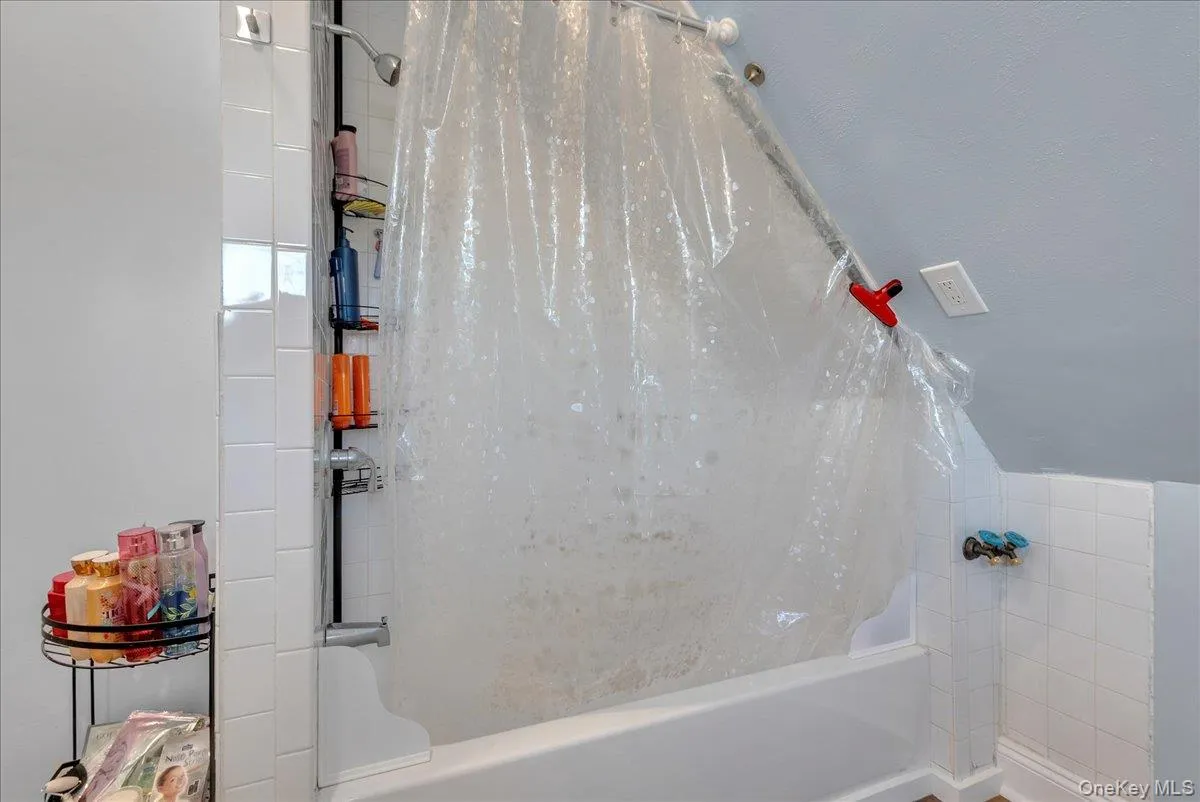 Bathroom featuring shower / tub combo Bathroom featuring shower / tub combo