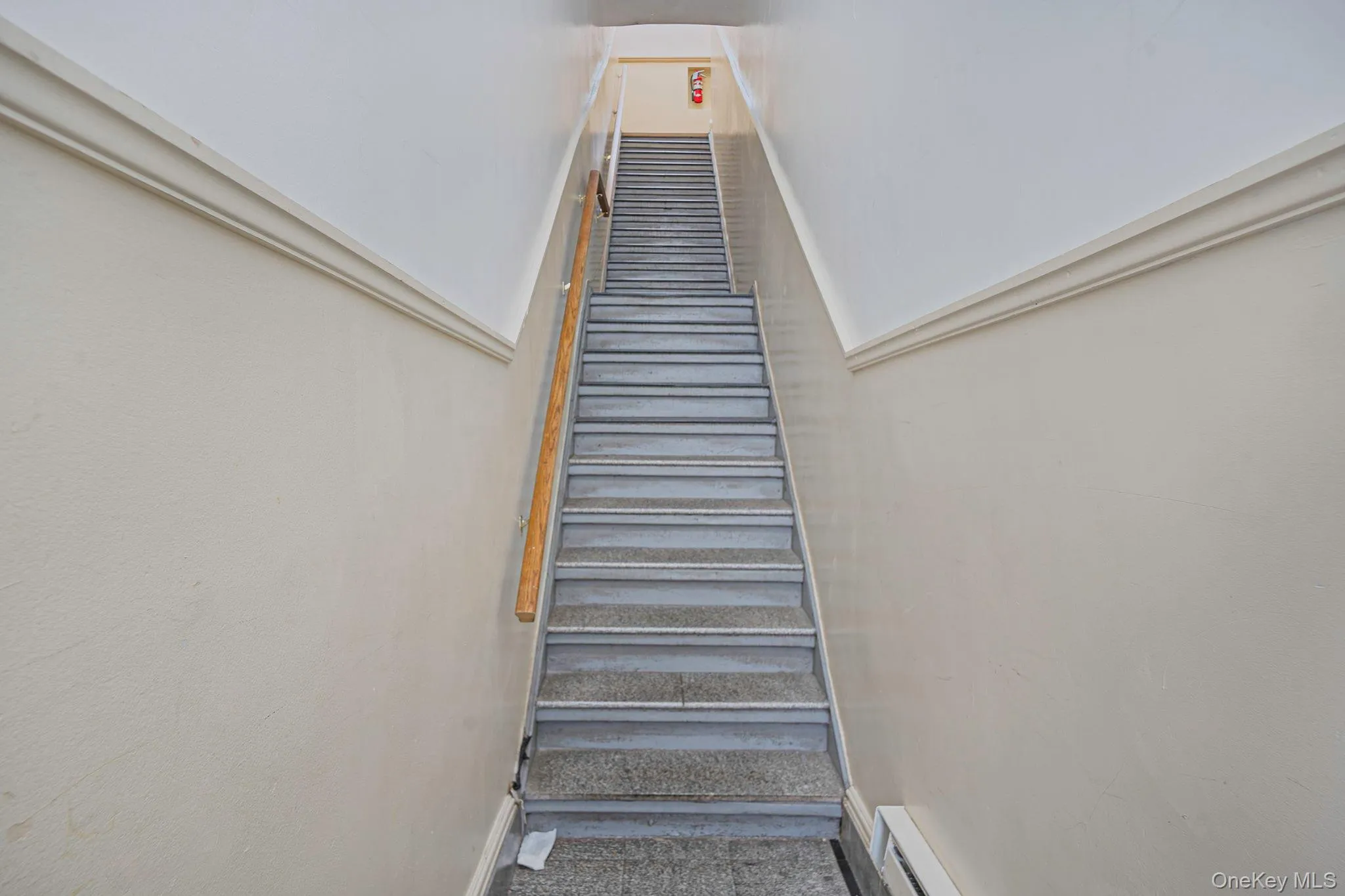 Staircase with baseboards and a baseboard heating unit Staircase with baseboards and a baseboard heating unit