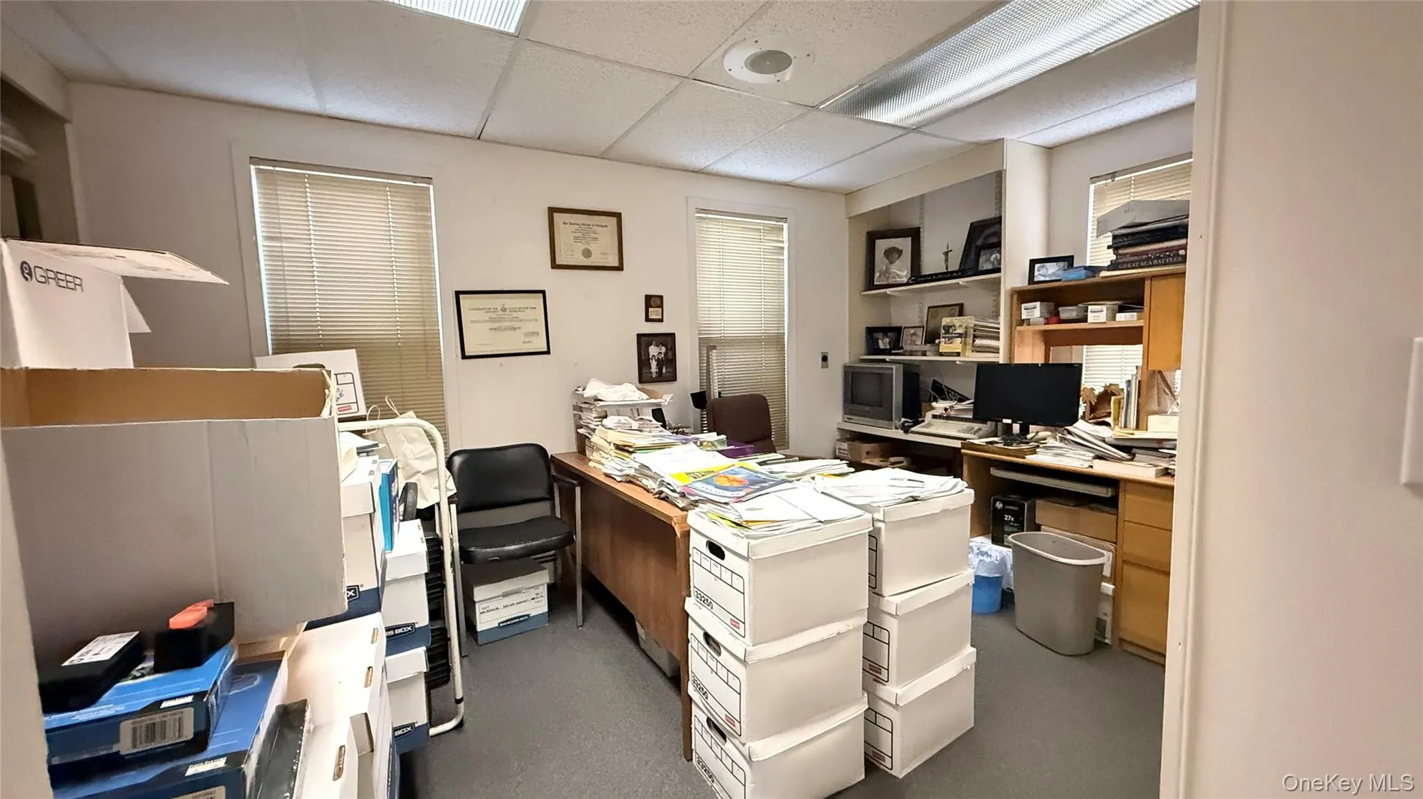 Office space featuring a paneled ceiling Office space featuring a paneled ceiling