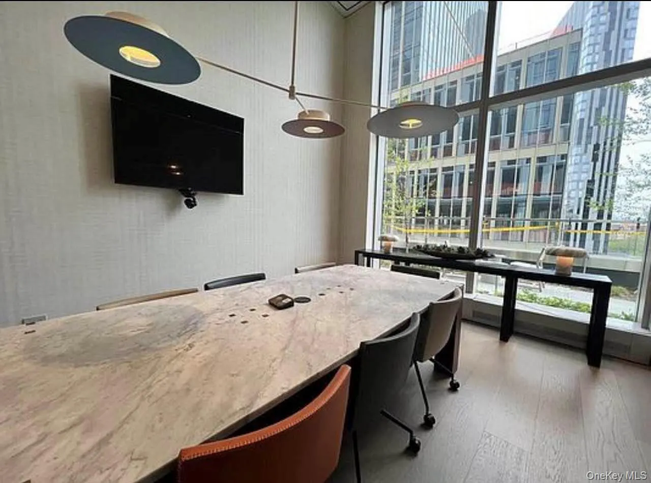 Office area with expansive windows and wallpapered walls Office area with expansive windows and wallpapered walls