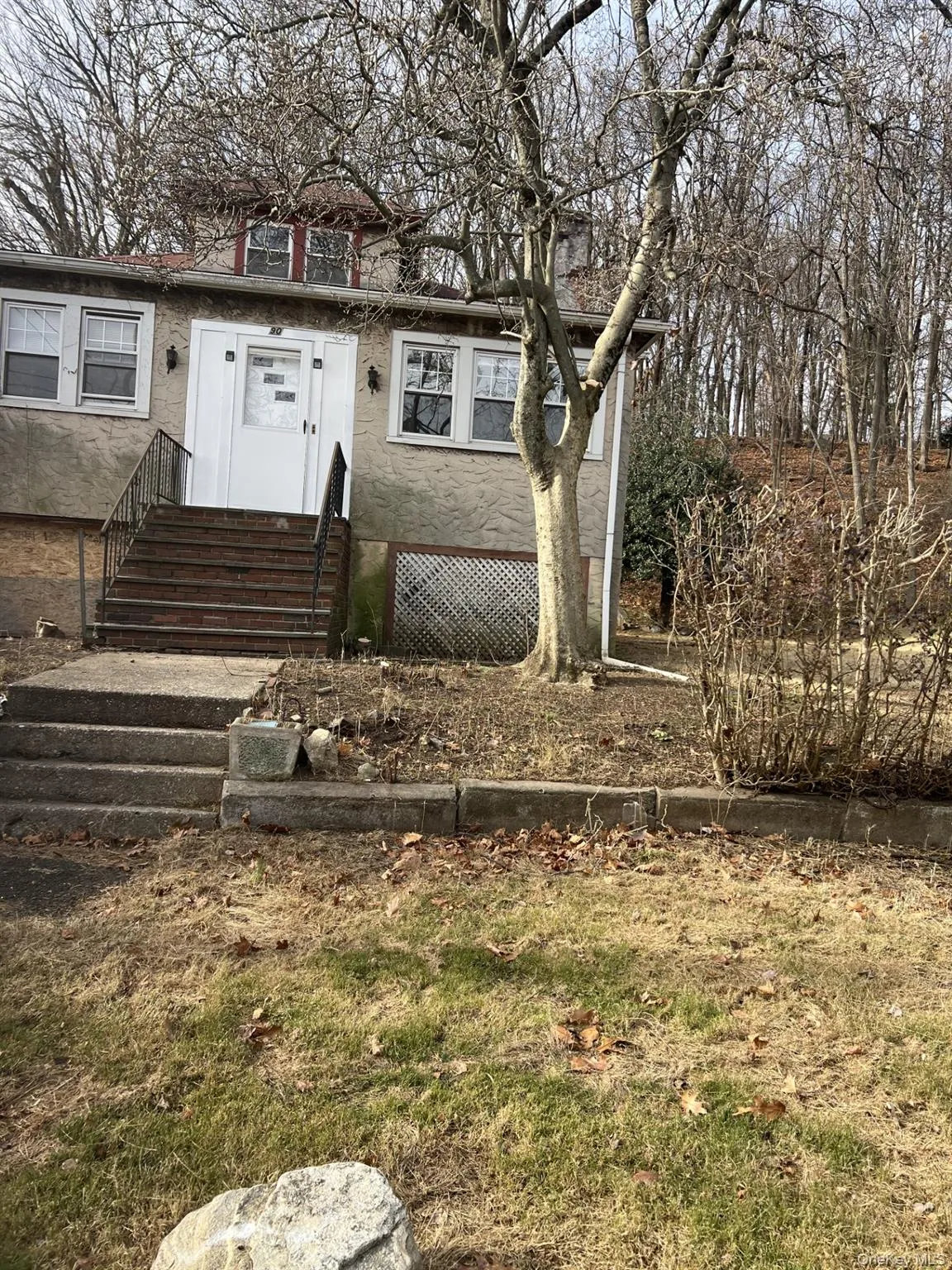 View of front of house featuring stucco siding View of front of house featuring stucco siding