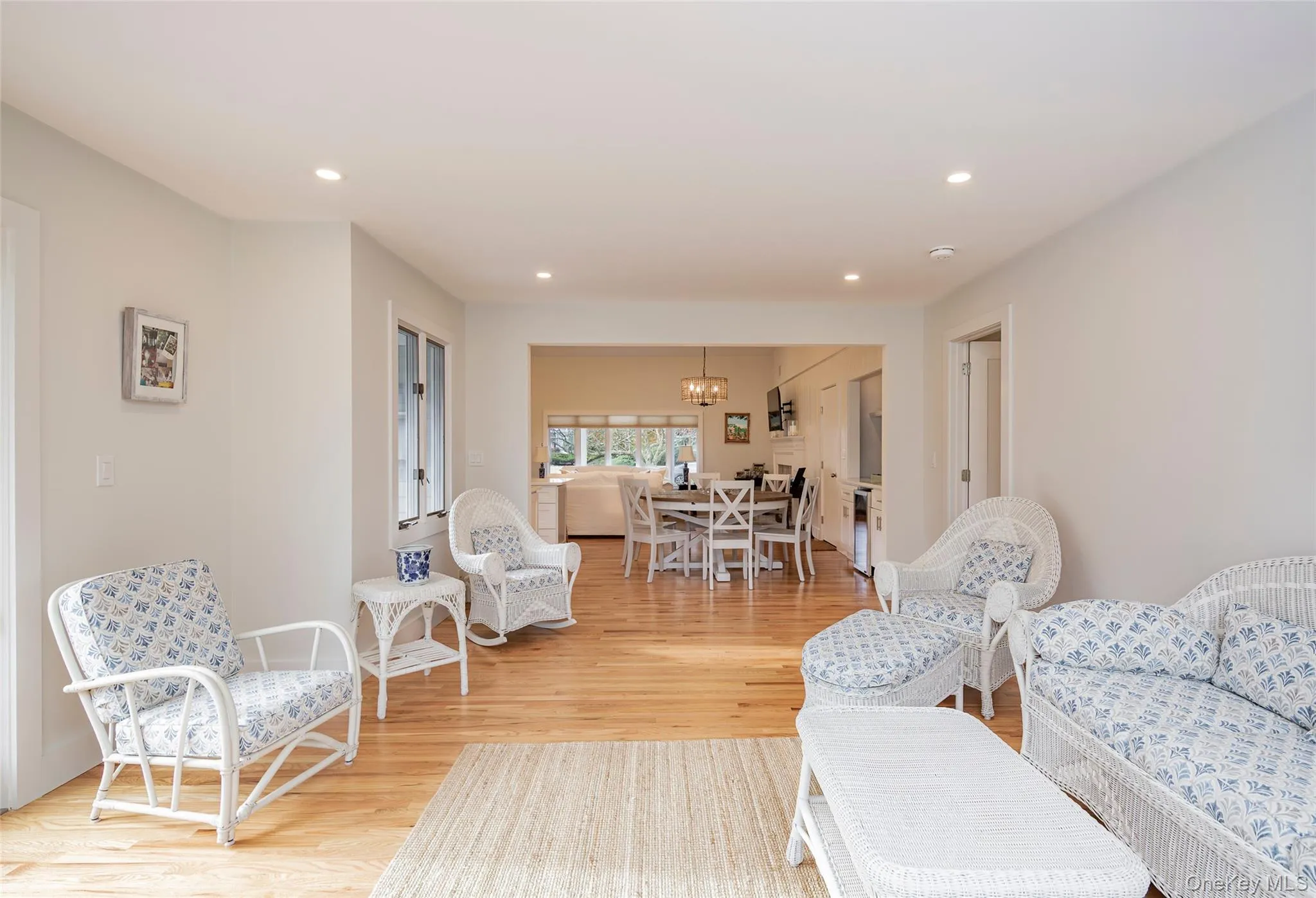 Living area featuring light wood-type flooring, a chandelier, and recessed lighting Living area featuring light wood-type flooring, a chandelier, and recessed lighting