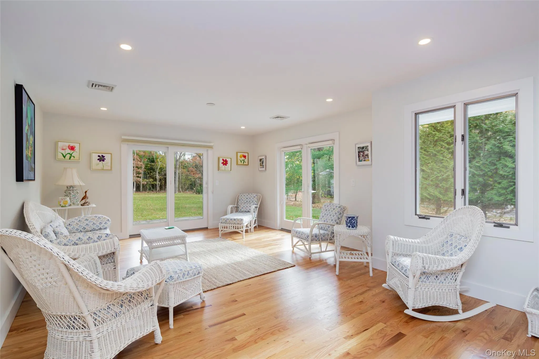 Sitting room featuring recessed lighting, plenty of natural light, and light wood finished floors Sitting room featuring recessed lighting, plenty of natural light, and light wood finished floors
