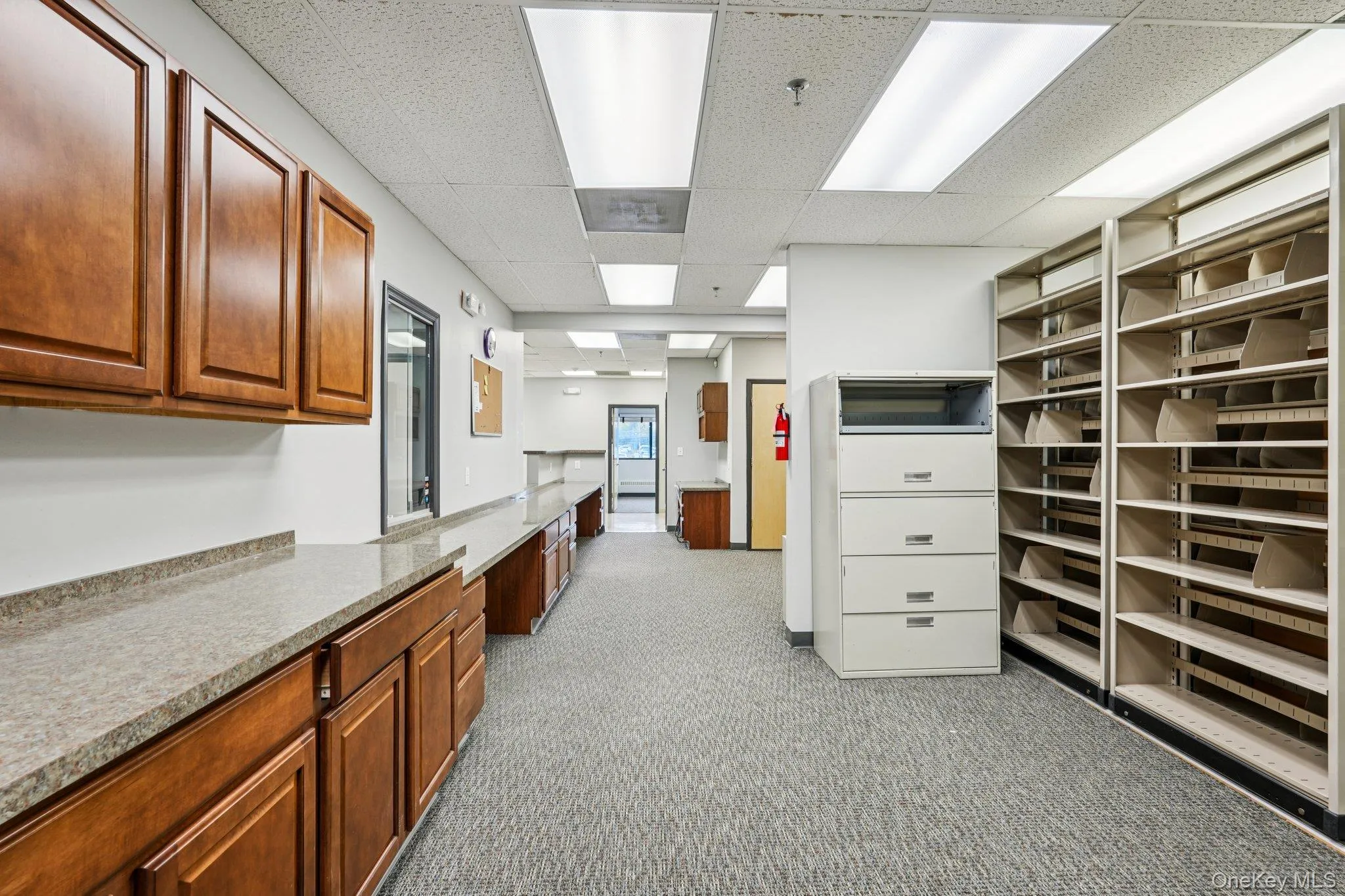 Kitchen with a paneled ceiling and brown cabinets Kitchen with a paneled ceiling and brown cabinets