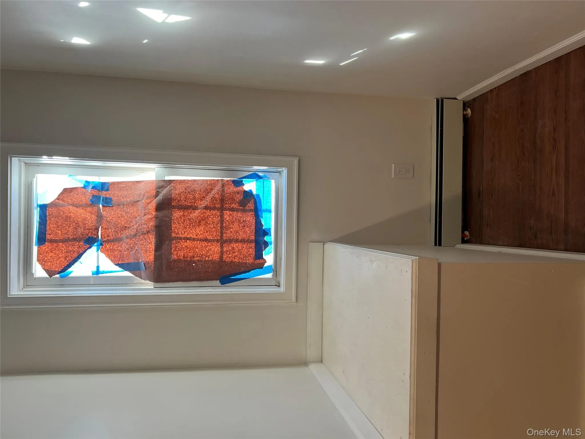 Detailed view of baseboard heating and wood finished floors Detailed view of baseboard heating and wood finished floors