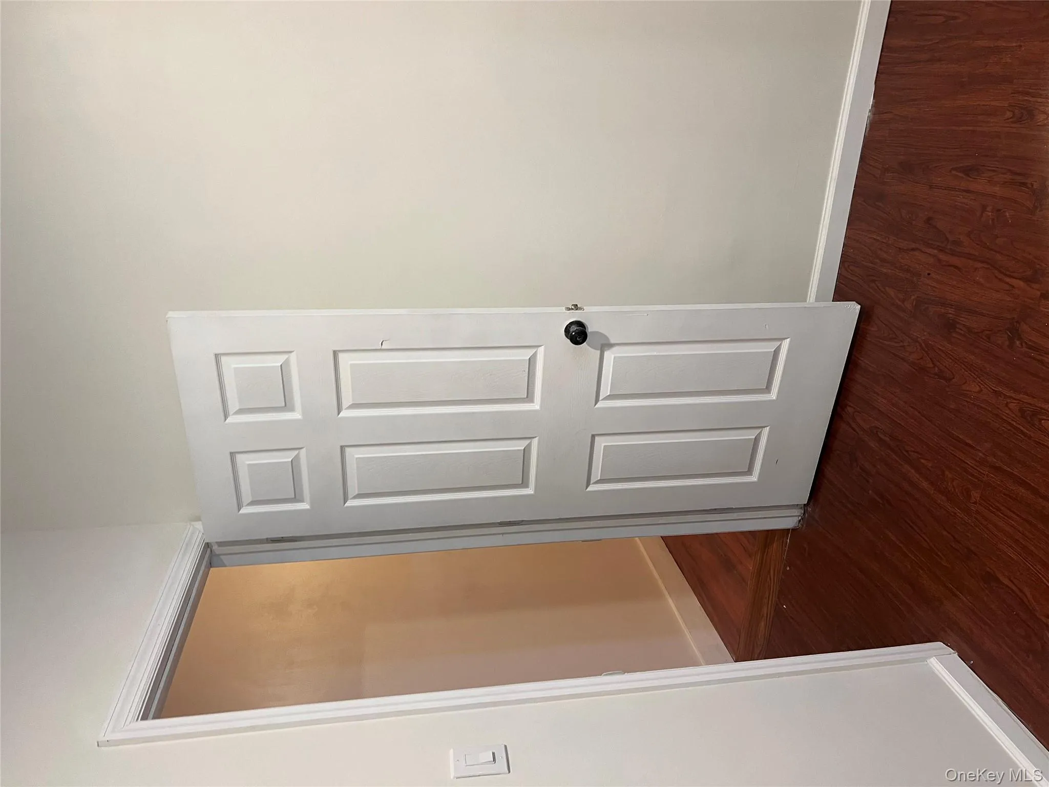 Spare room with baseboards and dark wood finished floors Spare room with baseboards and dark wood finished floors