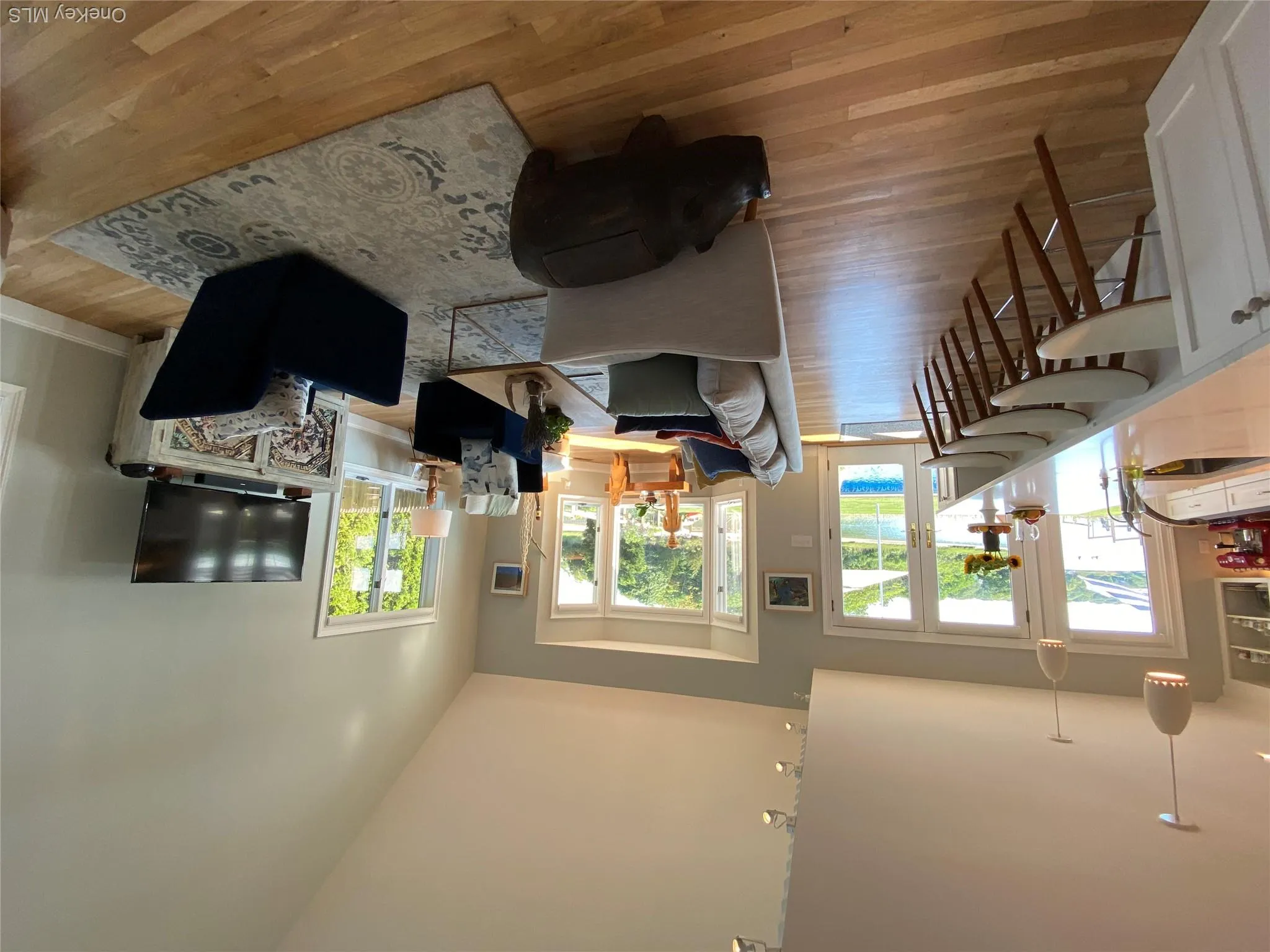 Open light filled living room with high vaulted ceiling Open light filled living room with high vaulted ceiling