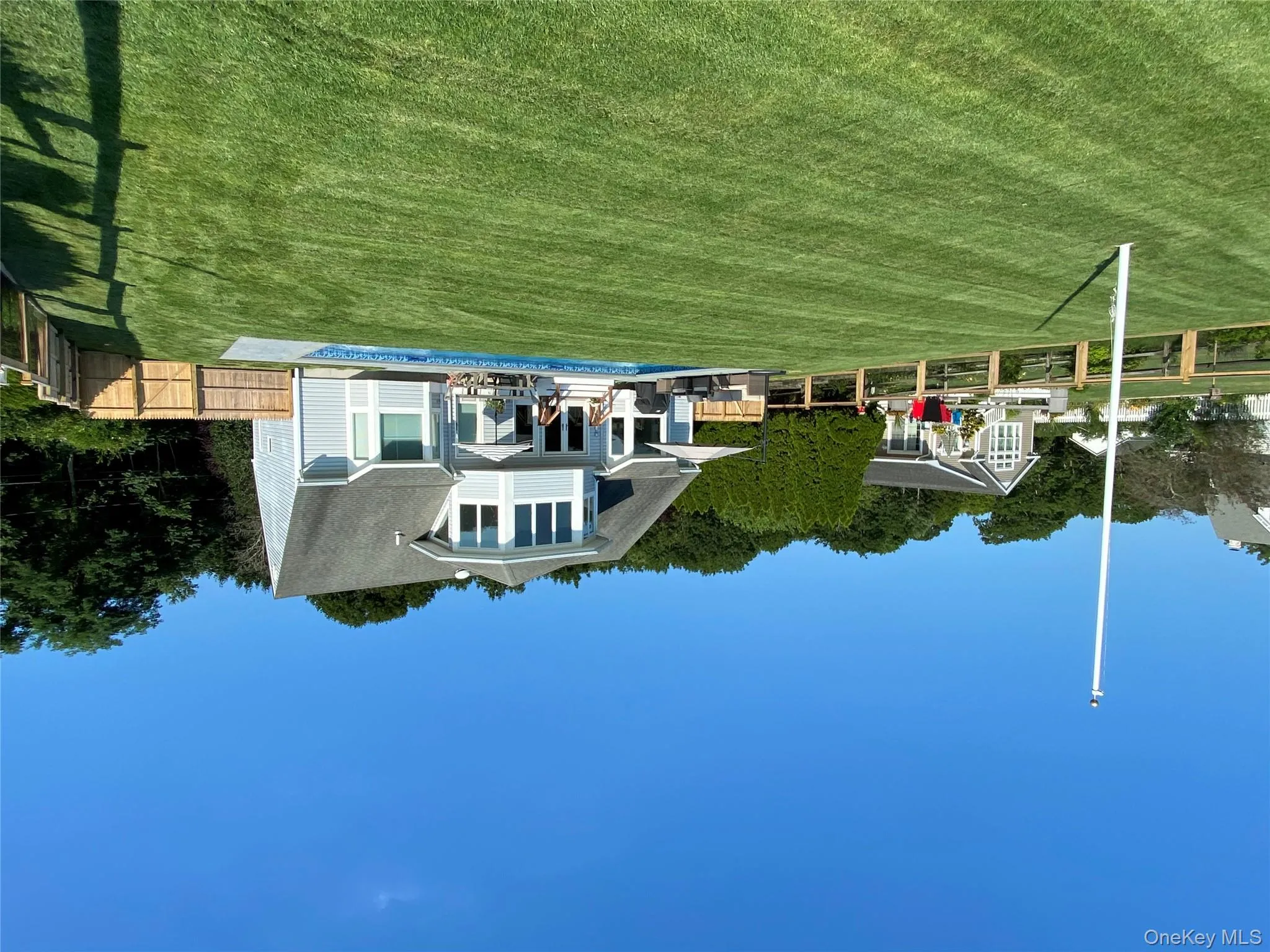 Nicely manicured yard for a game of croquet Nicely manicured yard for a game of croquet