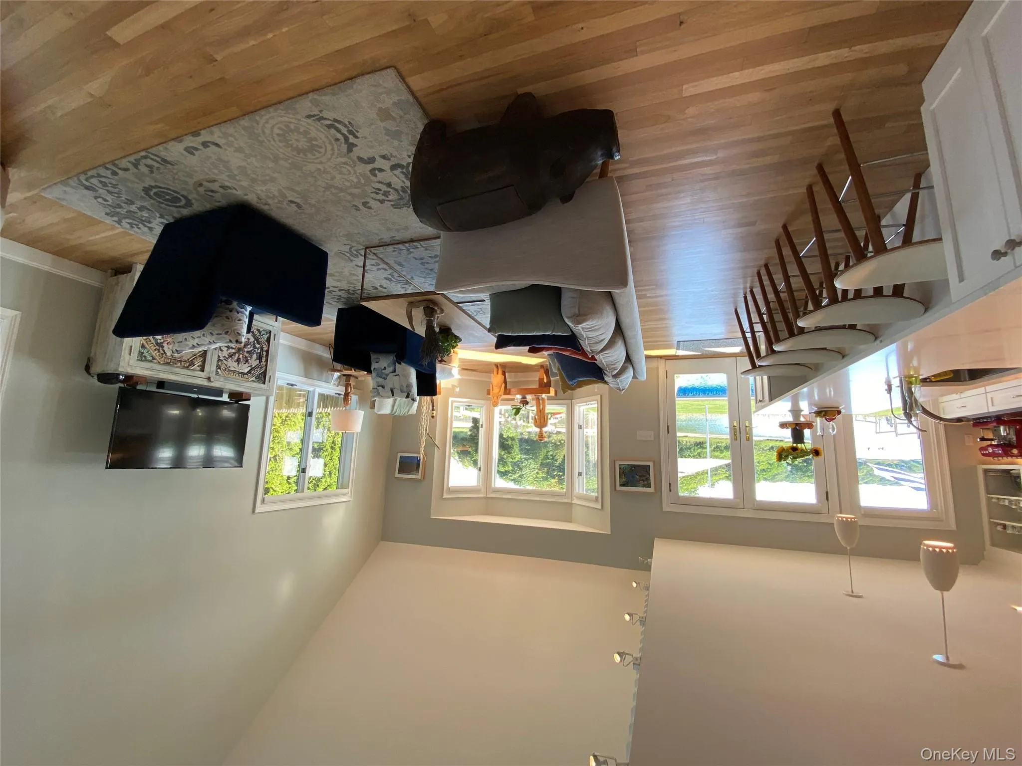 Open light filled living room with high vaulted ceiling Open light filled living room with high vaulted ceiling