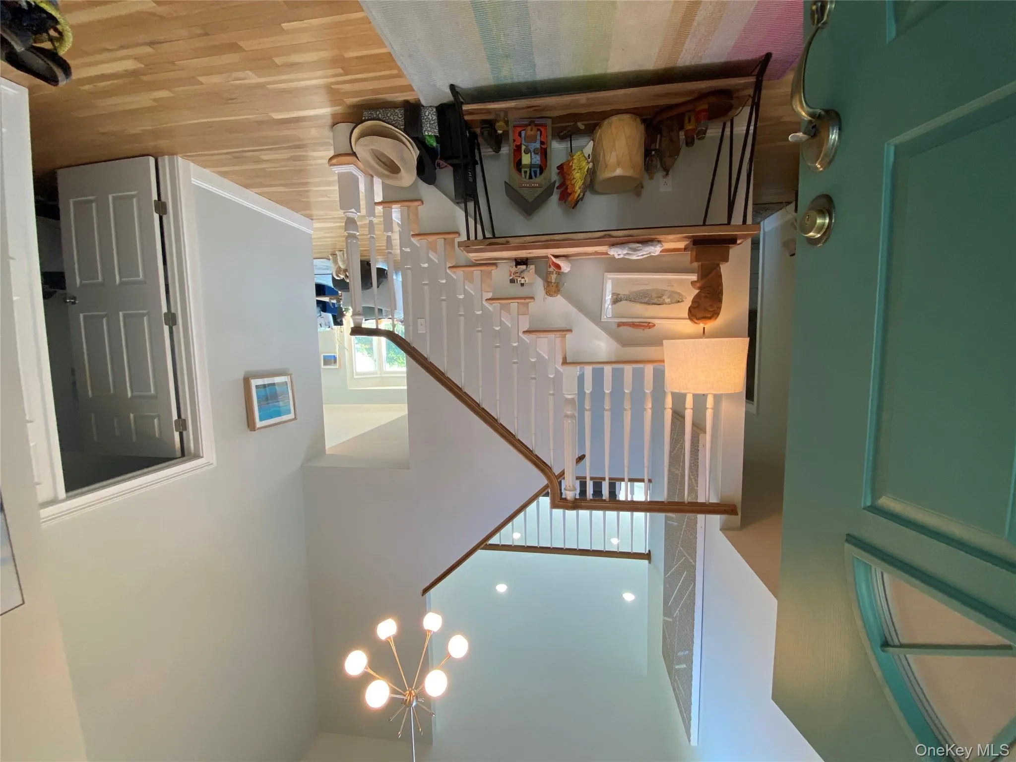 Entrance foyer featuring stairway leading to a beautiful sunroom with panoramic views . Entrance foyer featuring stairway leading to a beautiful sunroom with panoramic views .