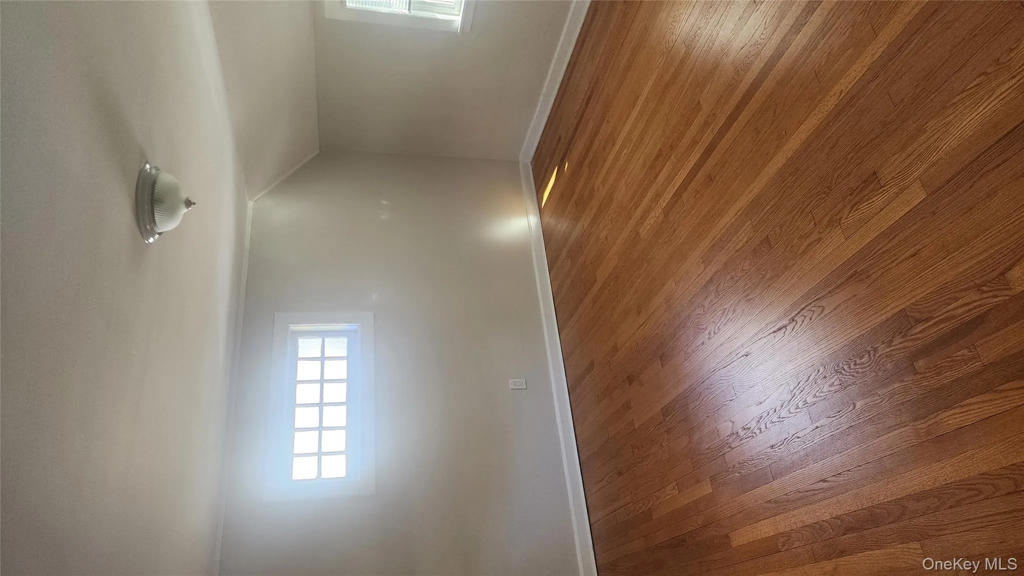 Bonus room featuring hardwood / wood-style flooring and vaulted ceiling Bonus room featuring hardwood / wood-style flooring and vaulted ceiling