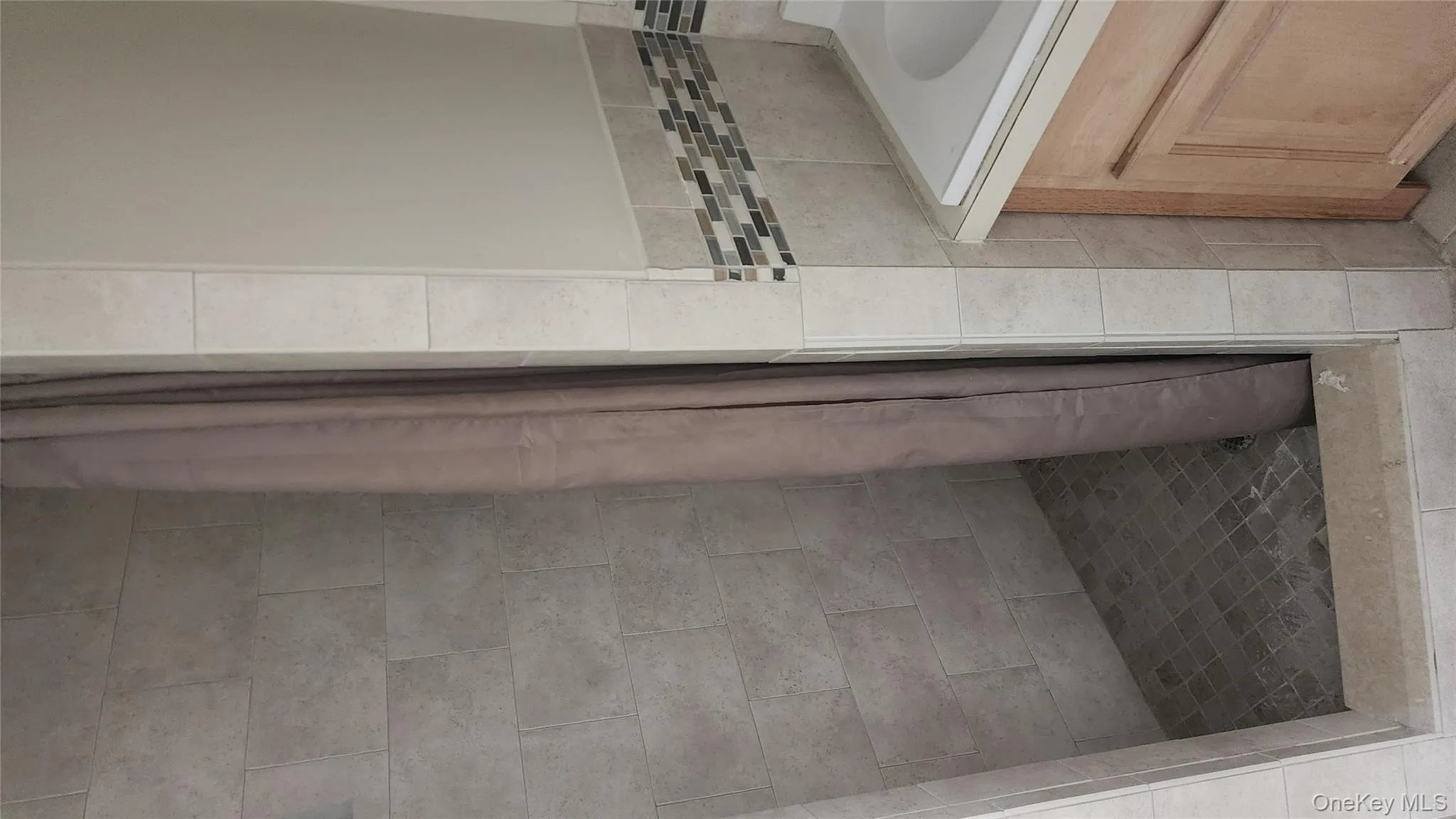 Full bath featuring a shower stall and vanity Full bath featuring a shower stall and vanity