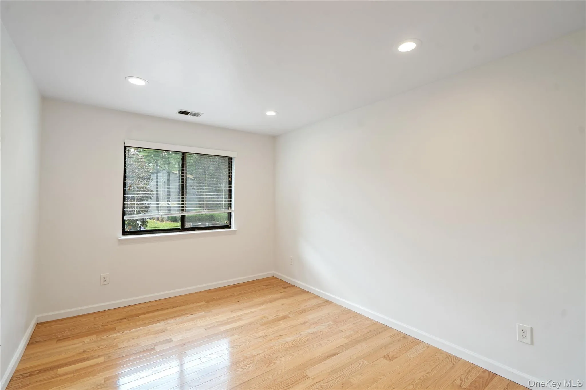 Spare room featuring light wood-style floors and recessed lighting Spare room featuring light wood-style floors and recessed lighting
