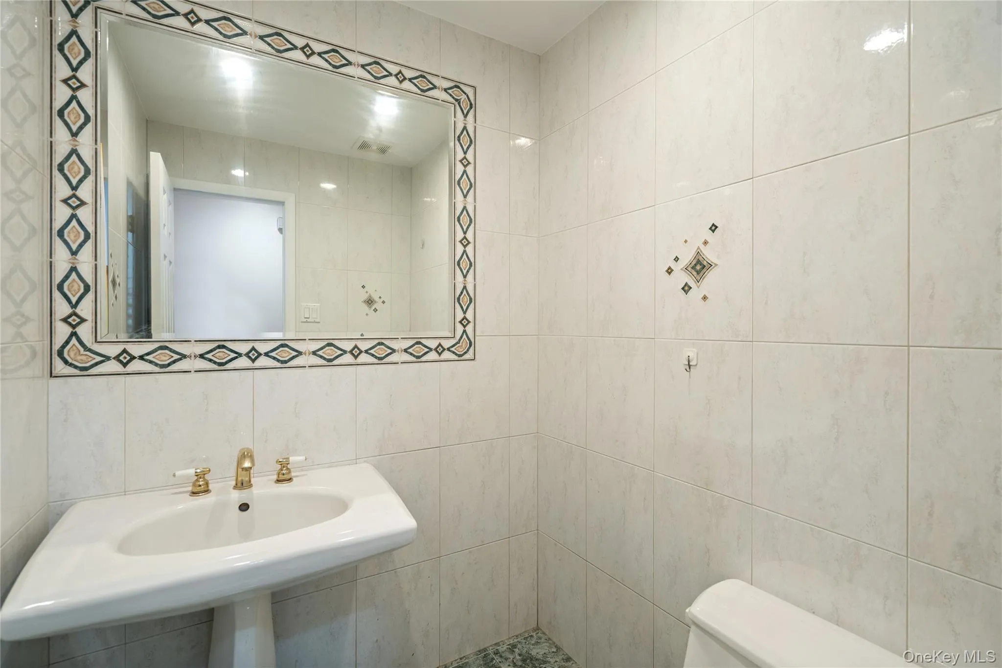 Bathroom featuring tile walls Bathroom featuring tile walls