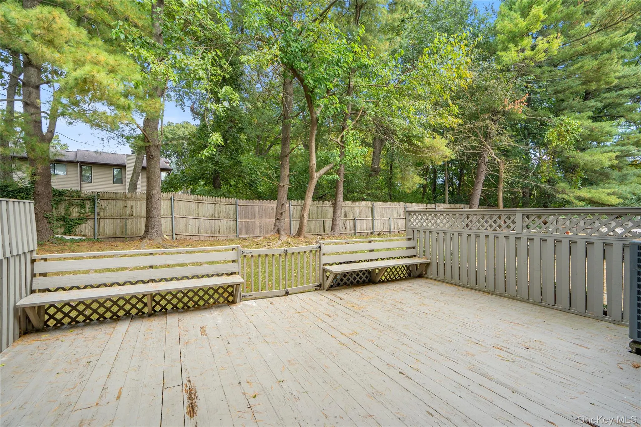 Wooden deck featuring a fenced backyard Wooden deck featuring a fenced backyard