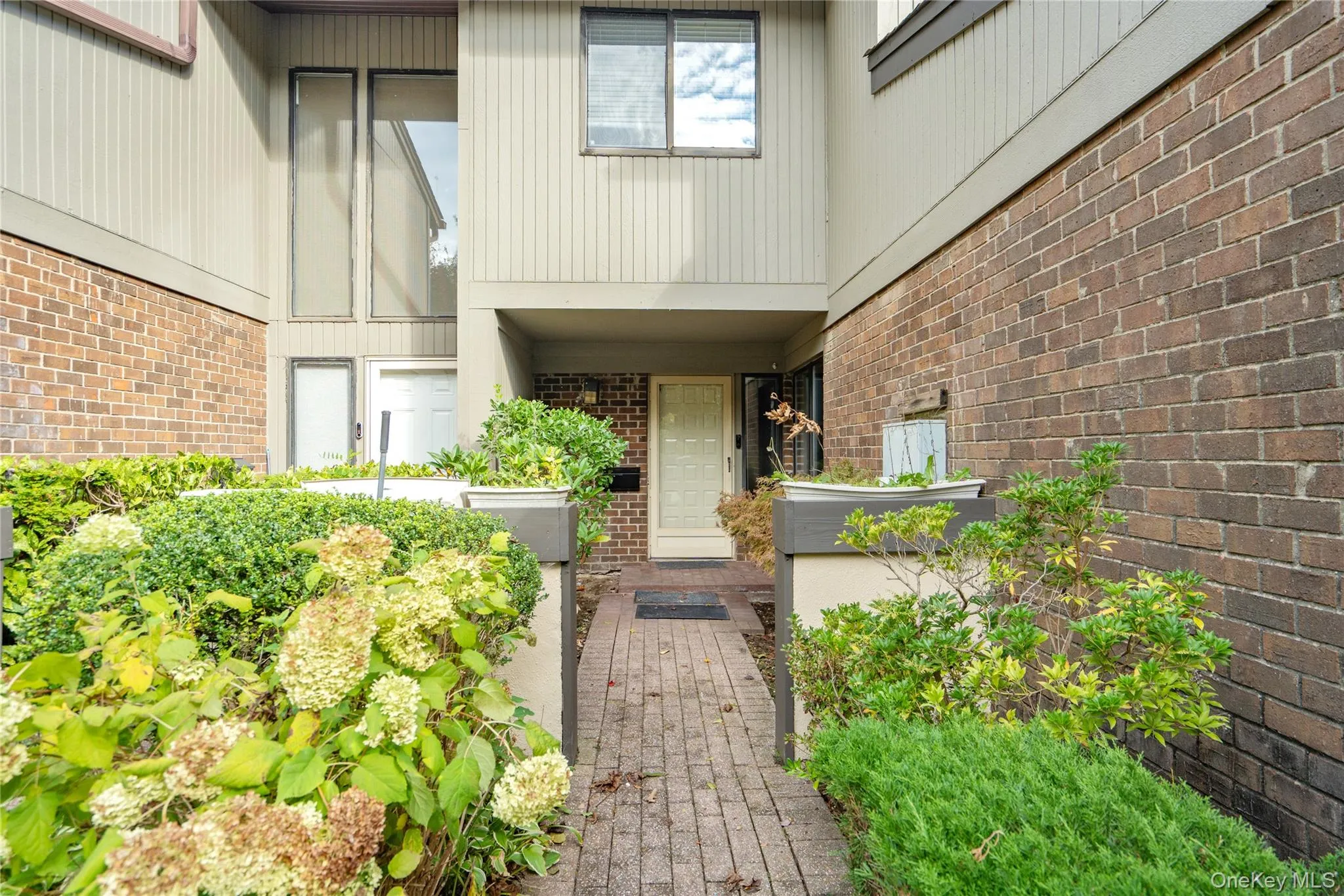 Property entrance featuring brick siding Property entrance featuring brick siding