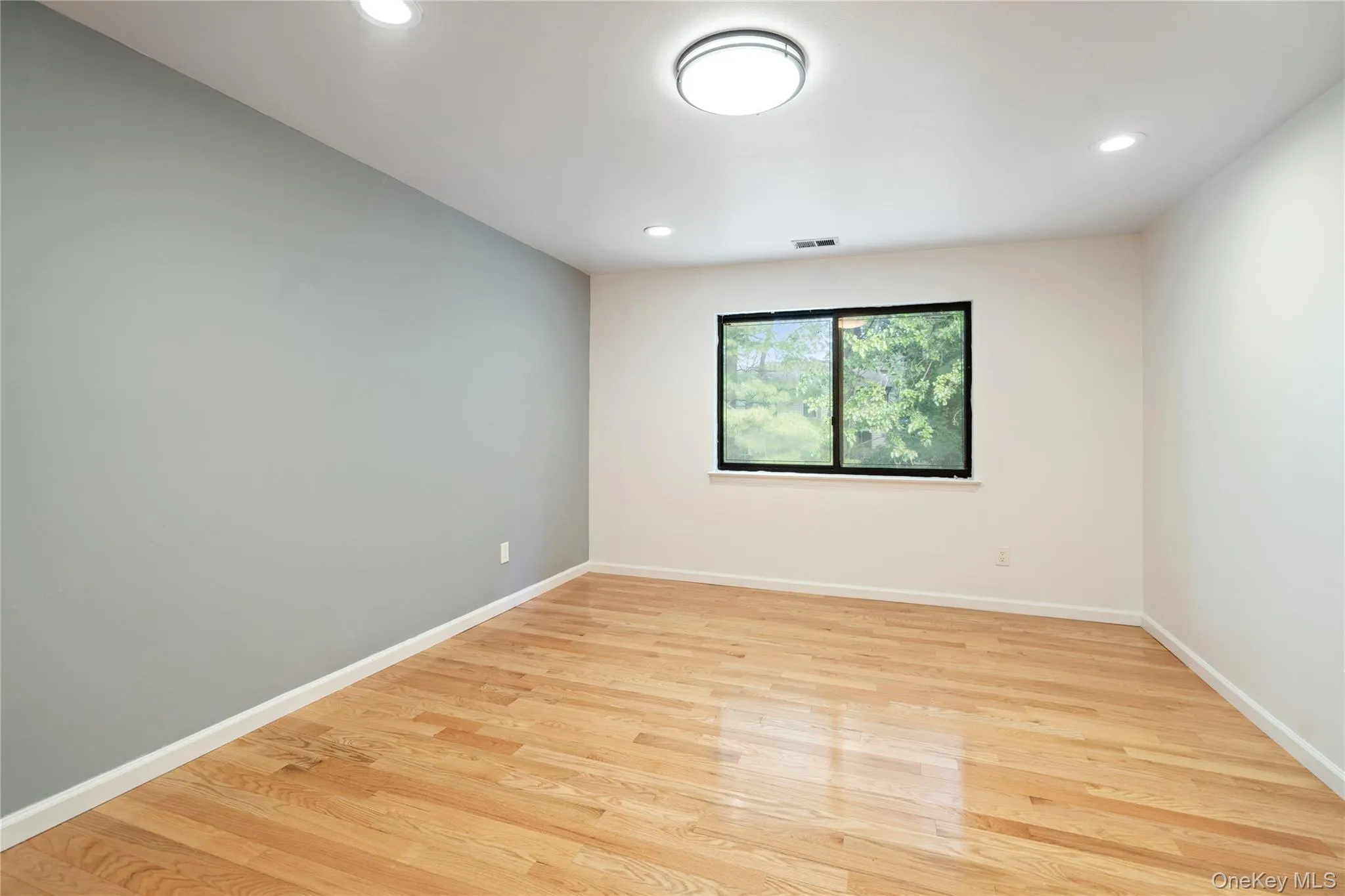 Spare room featuring light wood-style floors and recessed lighting Spare room featuring light wood-style floors and recessed lighting
