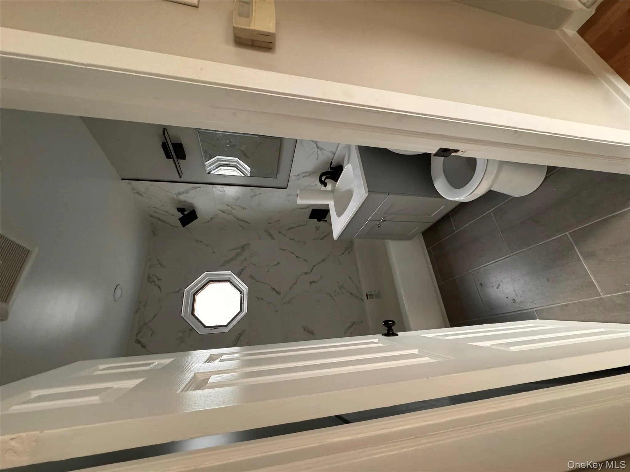 Bathroom featuring vanity and shower / tub combination Bathroom featuring vanity and shower / tub combination